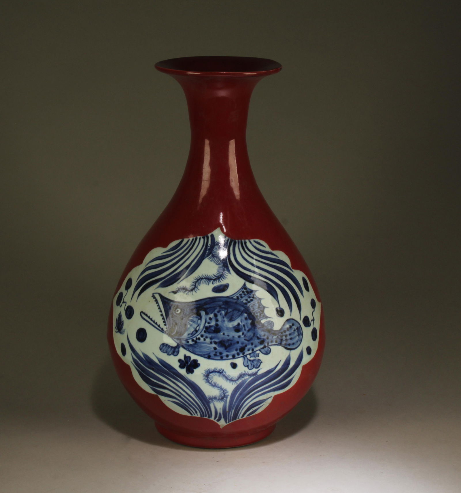 A Blue, White, and Red Vase with Lid: A Blue, White, and Red Vase with Lid and Fish Motif. Dimensions: 18" x 10".