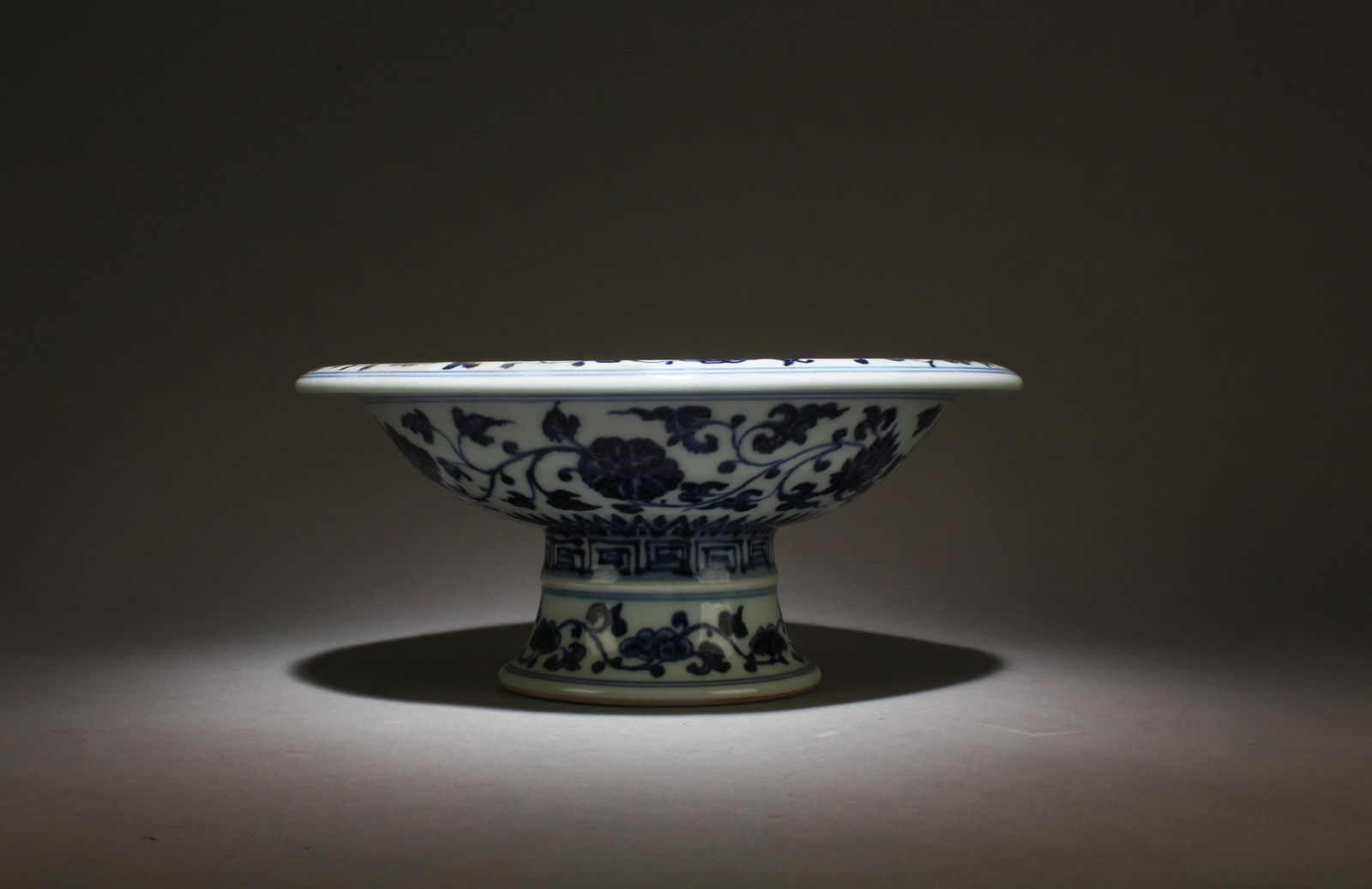 Chinese Blue & White Porcelain Stem Plate: Chinese Blue & White Porcelain Stem Plate, depicting fruits and leaves. 'XuanDe' mark on body. Diameter: 10.25" Height: 4.5"