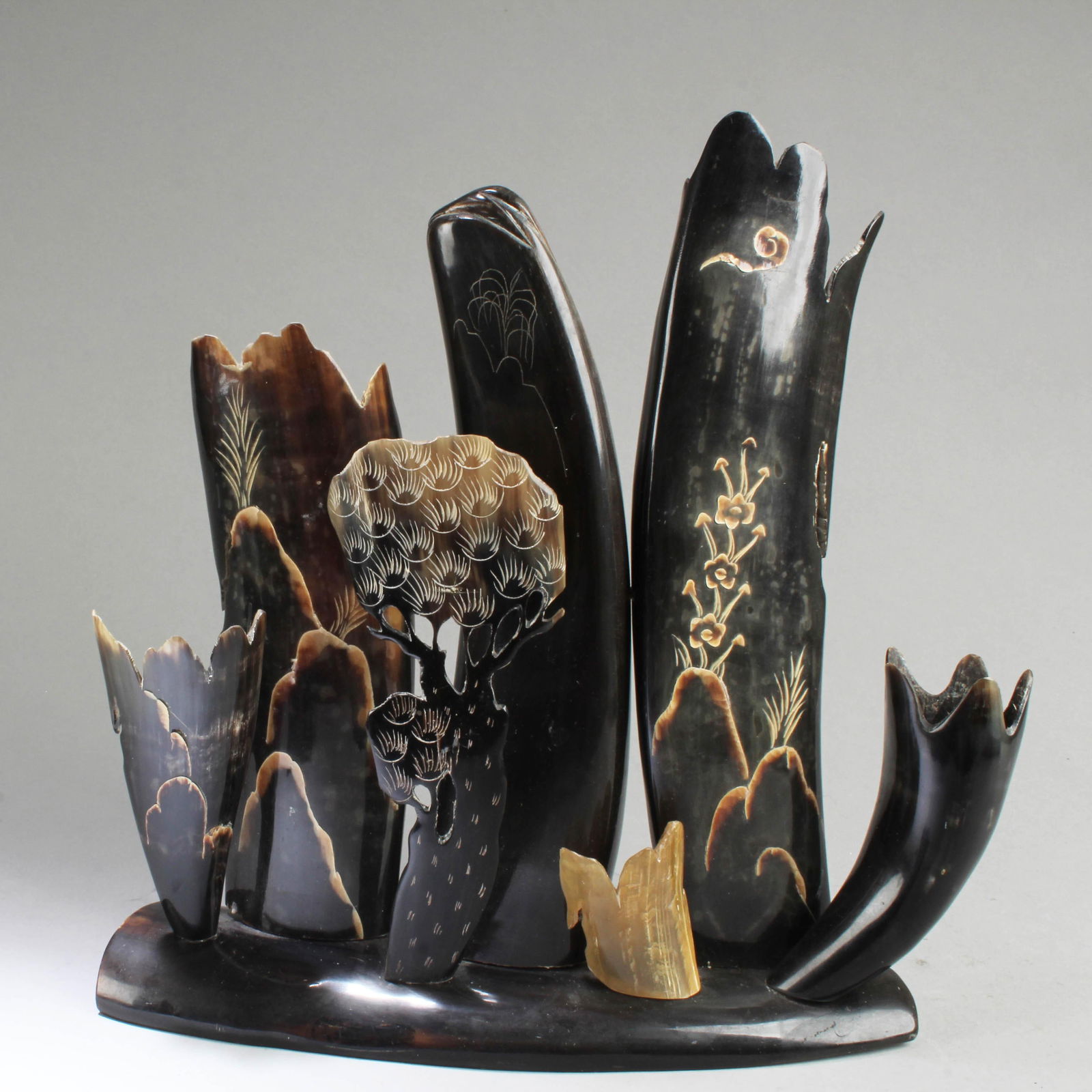 A Carved Horn Ornament: A Carved Horn Ornament. Length: 5.25"