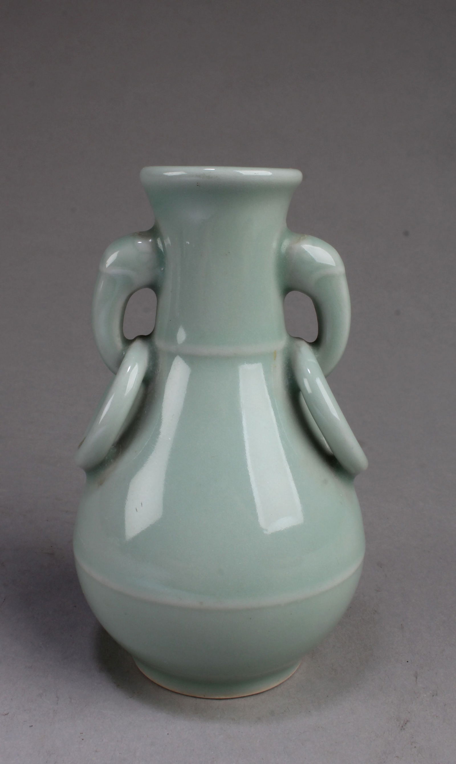 A Korean Celadon Vase: A Korean Celadon Vase. Height: 4.75"