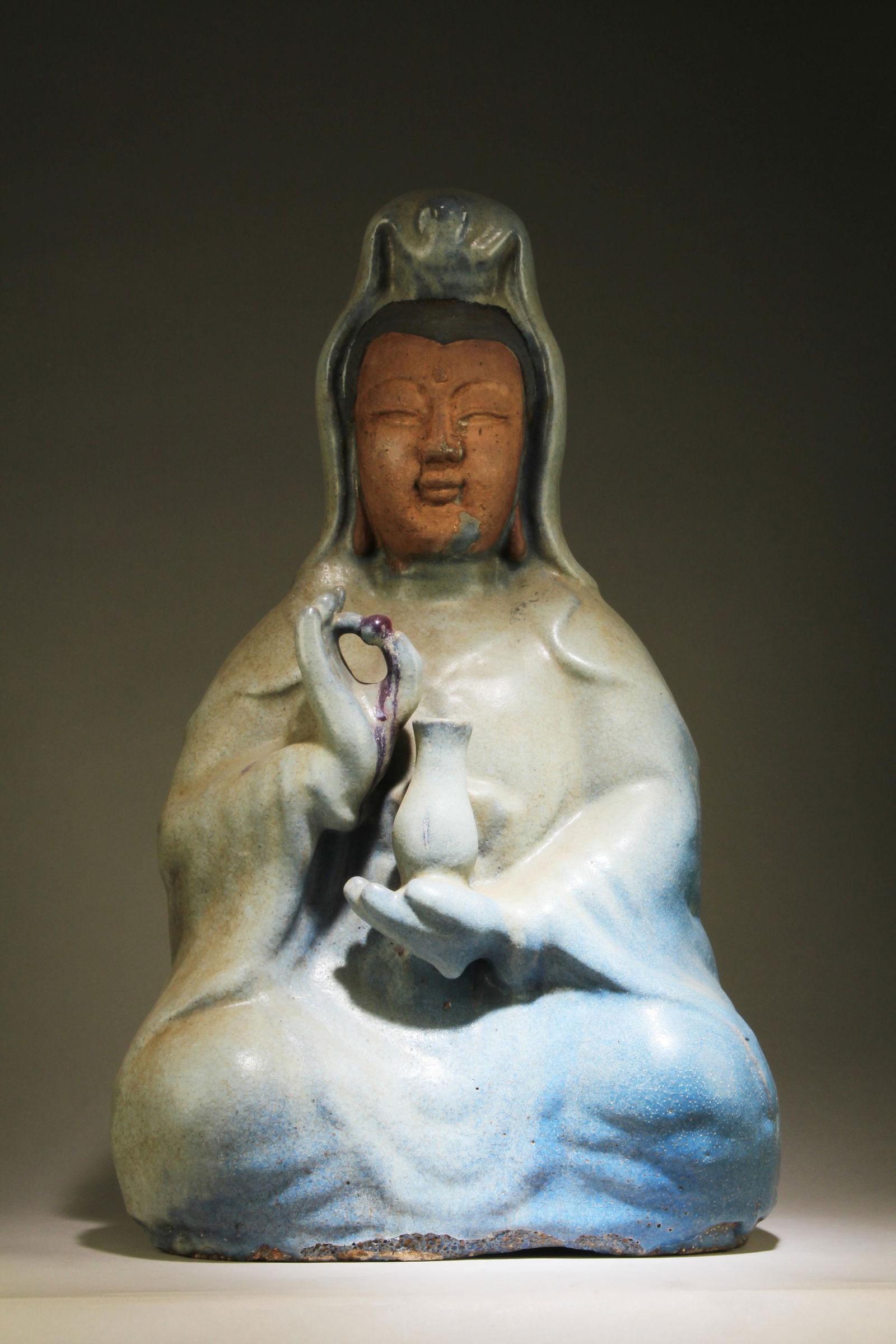 A Guanyin Statue: A Guanyin Statue. Dimensions: 26.5" x 15.75" x 11.75".