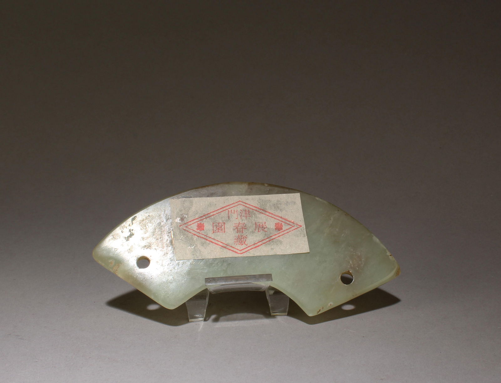 A Jade Ornament: A Jade Ornament. Dimension: 4.75" x 1.75