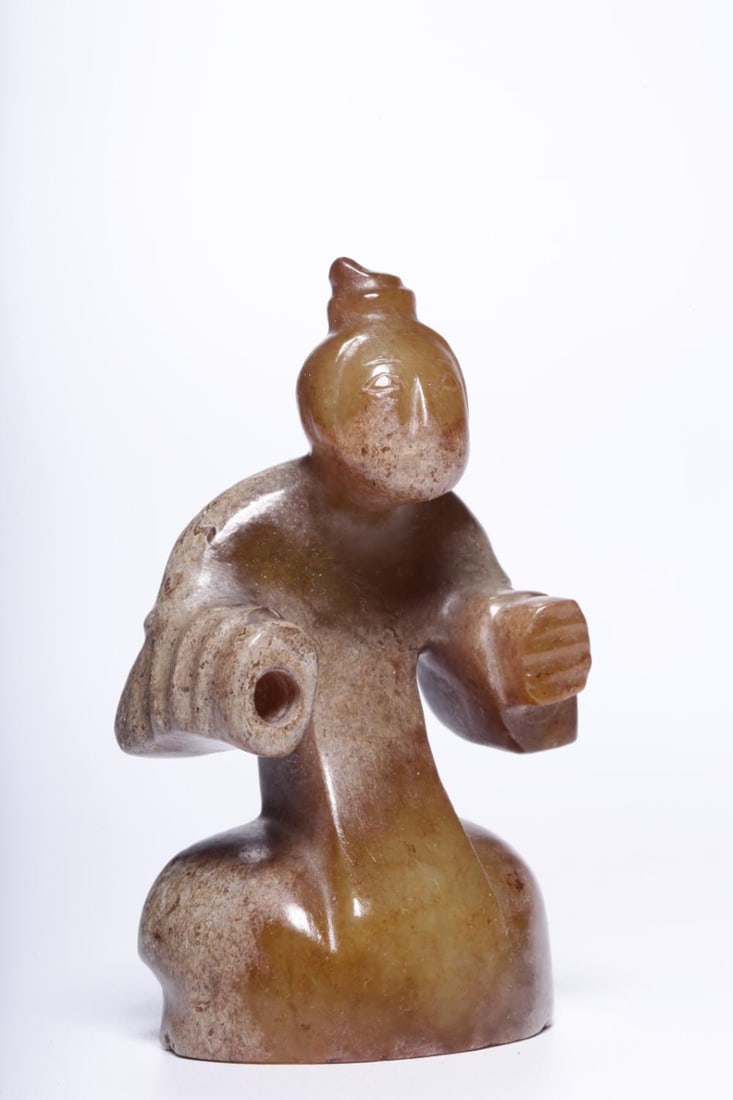 A Jade Ornament: A Jade Ornament. Height: 2.24in; Length: 1.26in; Width: 0.79in; Weight: 0.106lb.