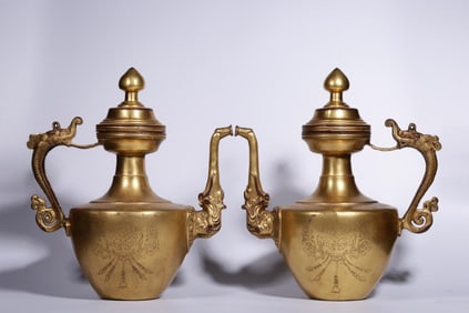 A Pair of Gilt Bronze Ewers