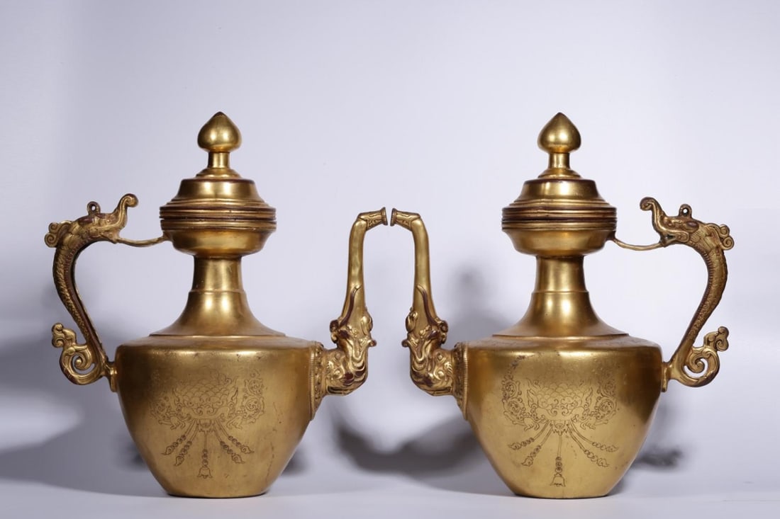 A Pair of Gilt Bronze Ewers: A Pair of Gilt Bronze Ewers. Height: 12.99in; Length: 11.42in; Width: 7.48in; Weight: 6.412lb.