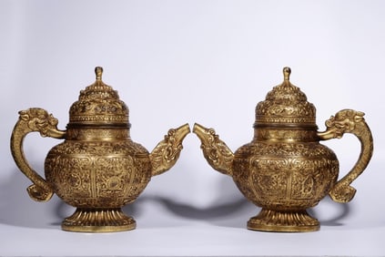 A Pair of Gilt Bronze Ewers