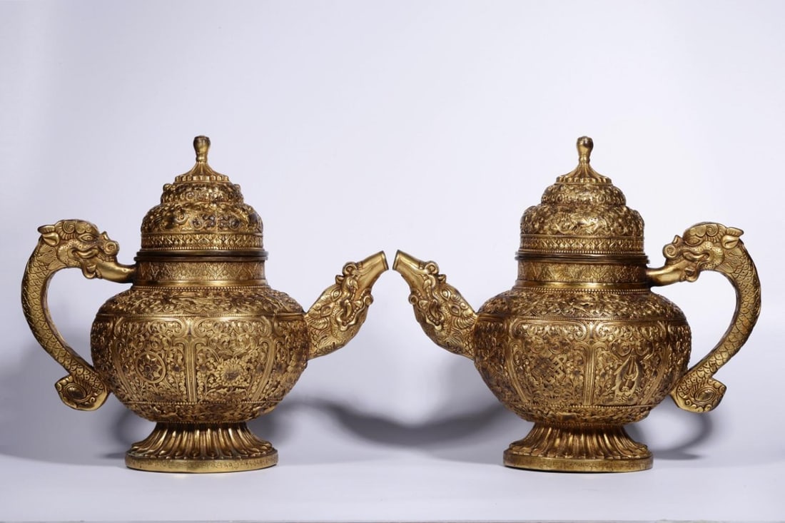 A Pair of Gilt Bronze Ewers: A Pair of Gilt Bronze Ewers. Height: 11.02in; Length: 12.20in; Width: 7.48in; Weight: 6.951lb.