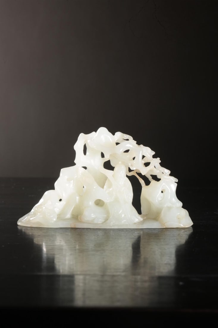 A Hetian White Jade Figure Ornament: A Hetian White Jade Figure Ornament. Length: 4.33in; Width: 1.57in; Height: 2.36in; Weight: 0.297lb.