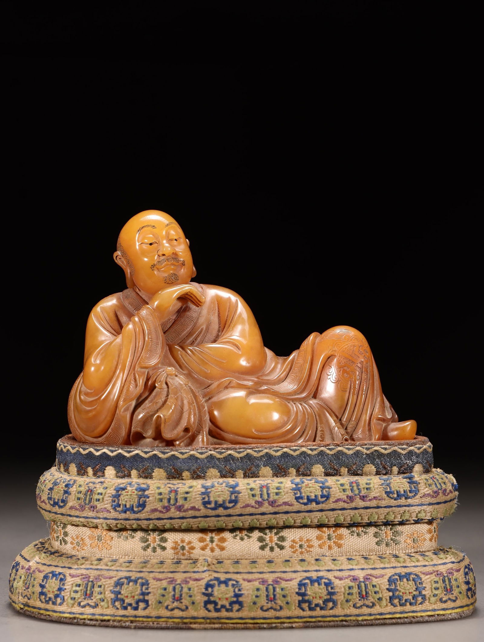A Shoushan Tianhuang Stone Arhat Statue: A Shoushan Tianhuang Stone Arhat Statue. Height: 2.95in; Length: 4.06in; Width: 2.17in; Weight: 0.701lb.