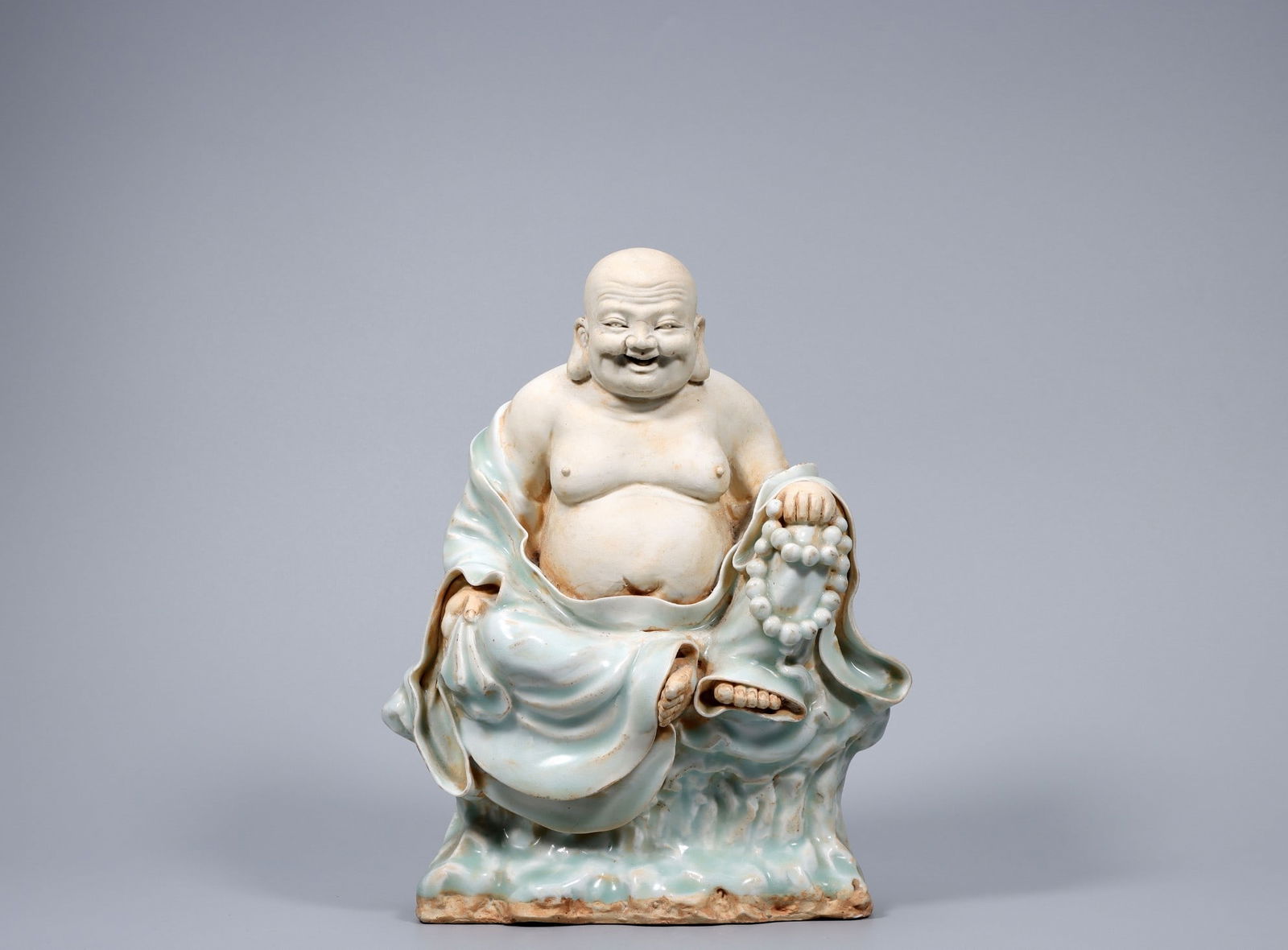 A Qingbai Porcelain Maitreya Buddha Statue: A Qingbai Porcelain Maitreya Buddha Statue. Height: 9.45in; Length: 7.48in; Width: 3.94in; Diameter: 6.30in; Weight: 4.007lb.