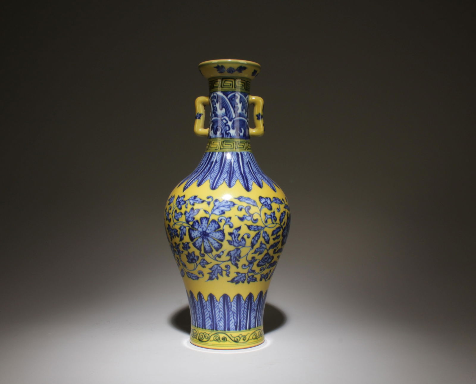 A Blue and Yellow Vase: A Blue and Yellow Vase. Dimensions: 5" x 10.9".