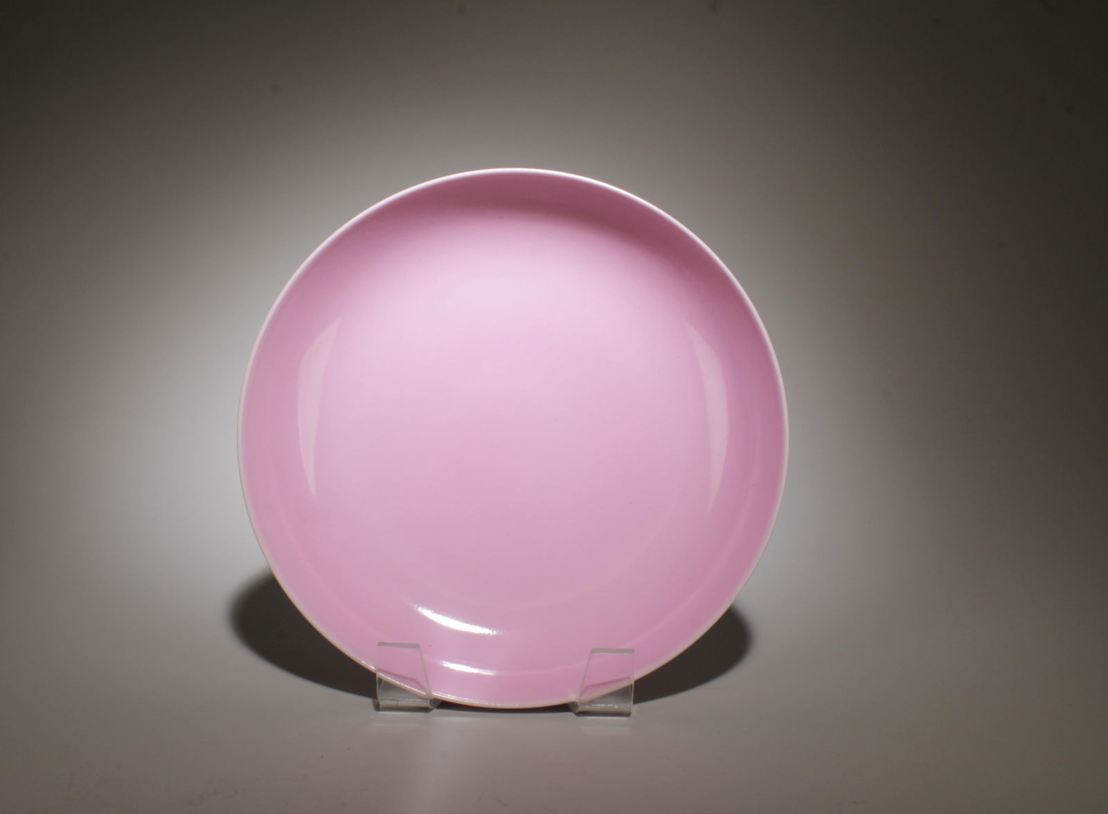 A Pink Glazed Plate: A Pink Glazed Plate. "YongZheng" mark at base. Diamater: 8". Height: 1.5".