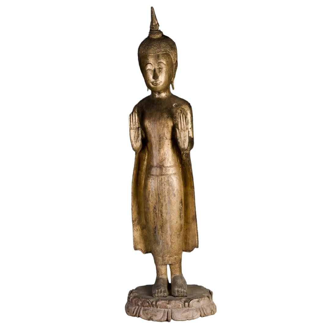 A Gilt Wood Statue: Gilt wood statue of a smiling Buddha holding both hands up in praying posture. Length 9.75" Width 8.5" Height 3.25"