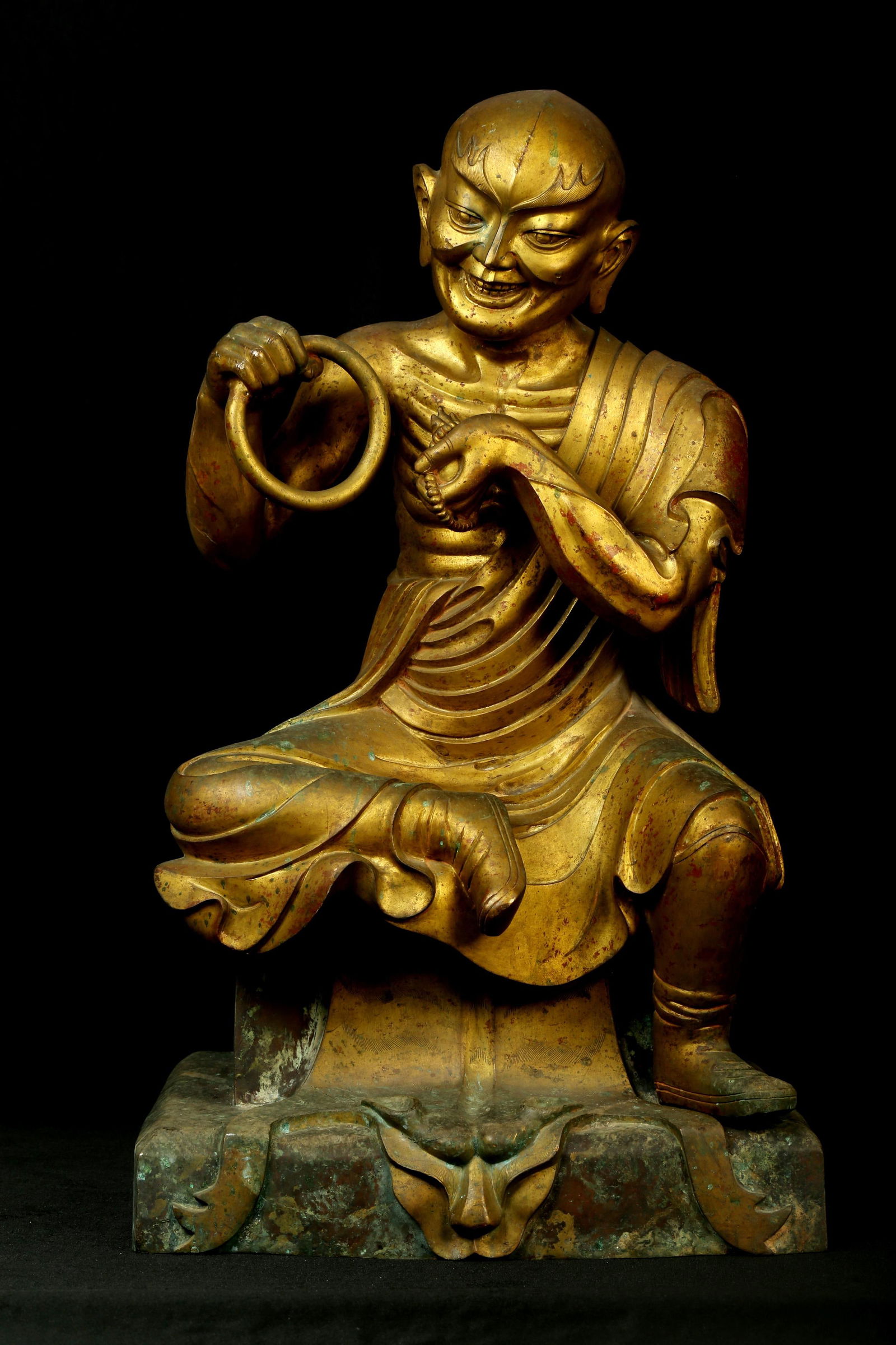 A Gilt Bronze Enlightened Monk Statue: A Gilt Bronze Enlightened Monk Statue. Height: 24.41in. Length: 14.57in. Width: 11.34in.
