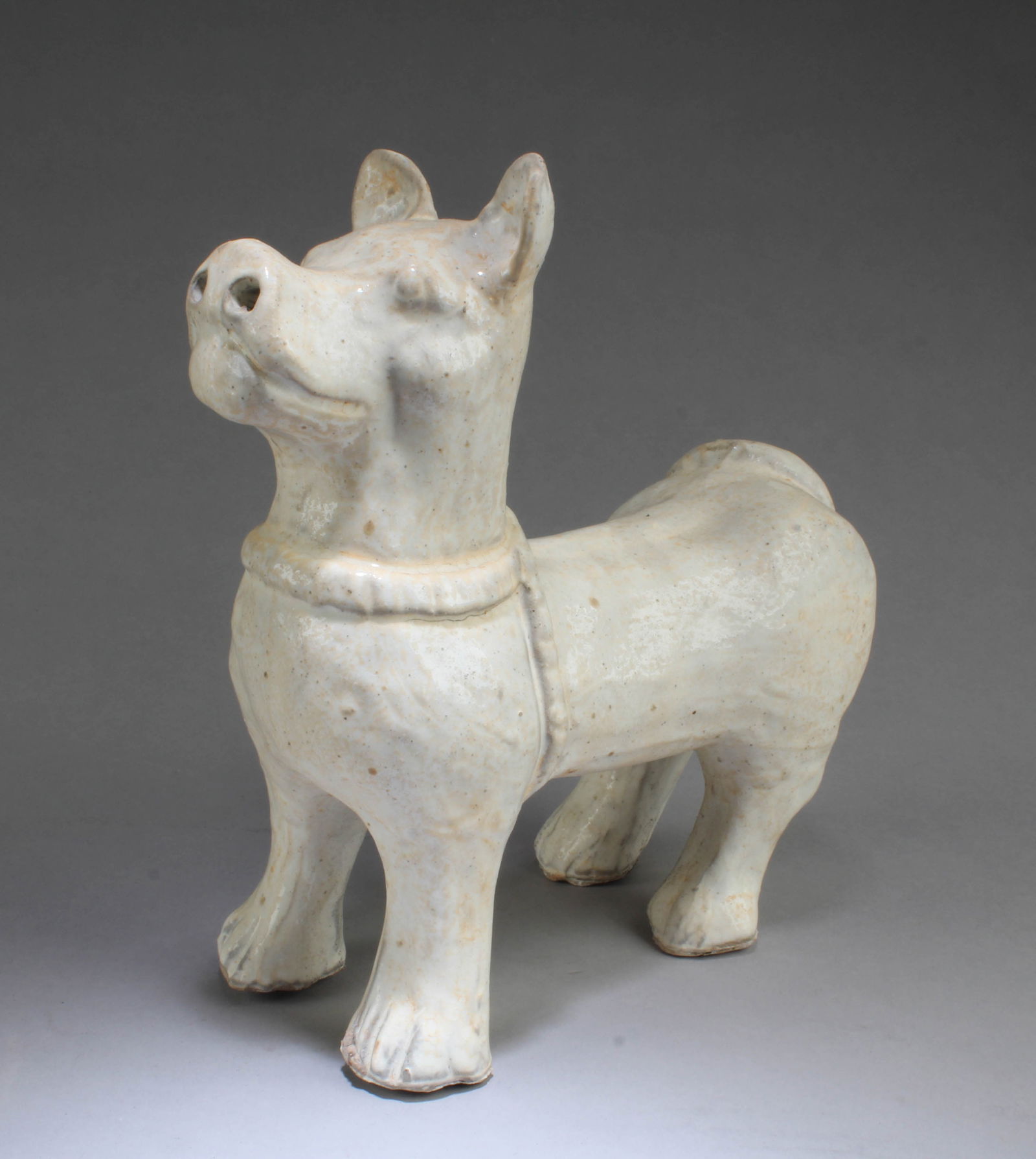 A Porcelain Dog Figurine (1 of 3)