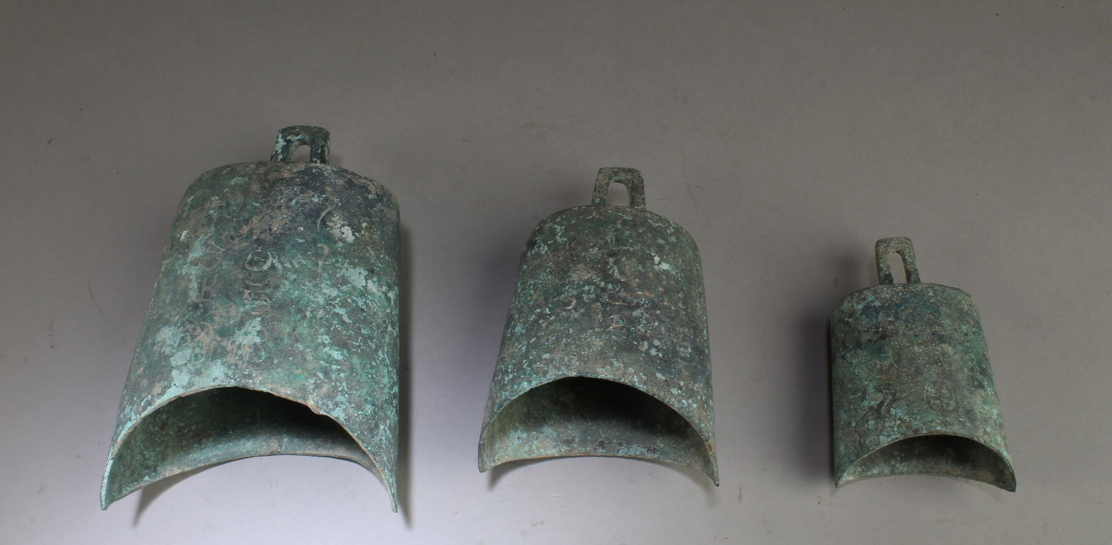 A Group of Three Bronze Bells (1 of 3)
