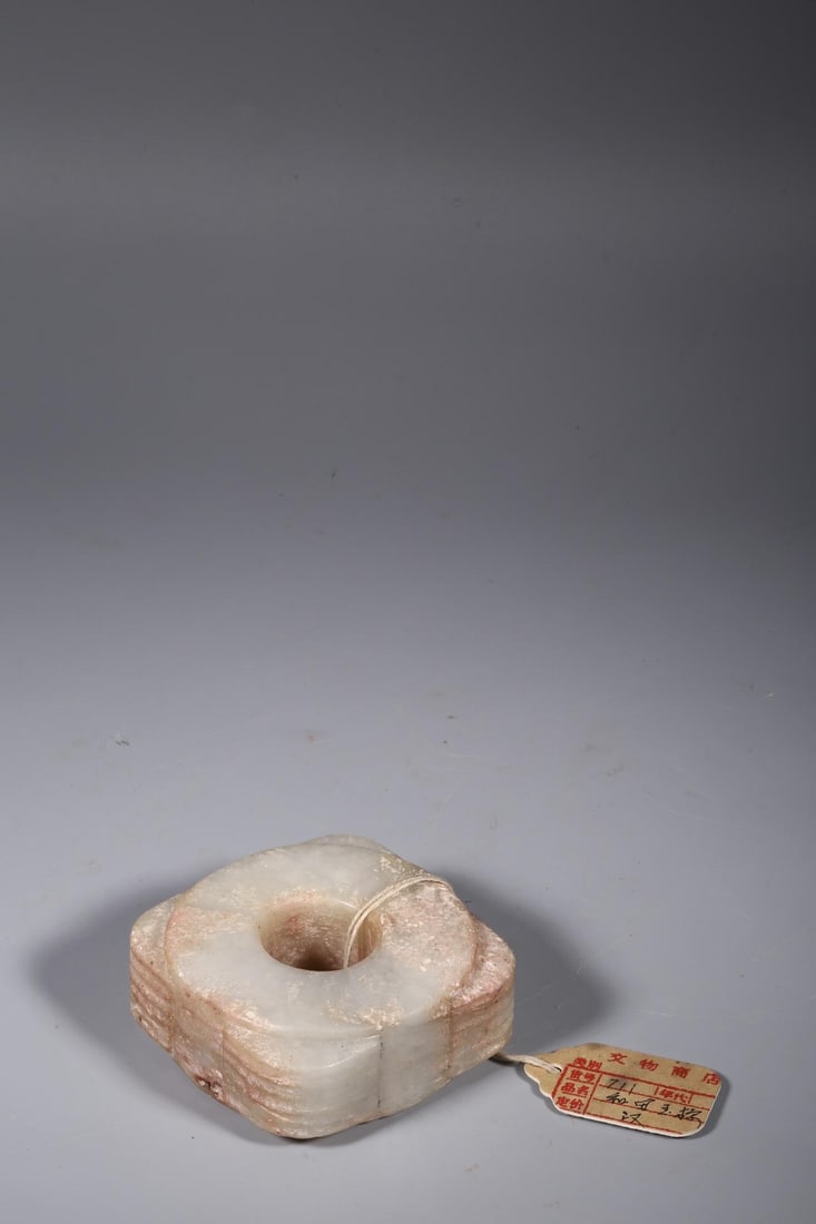 An Archaic Jade Cong: An Archaic Jade Cong. Dimensions: 3.23in x 3.23in x 1.38in; Weight: 1.12lbs.