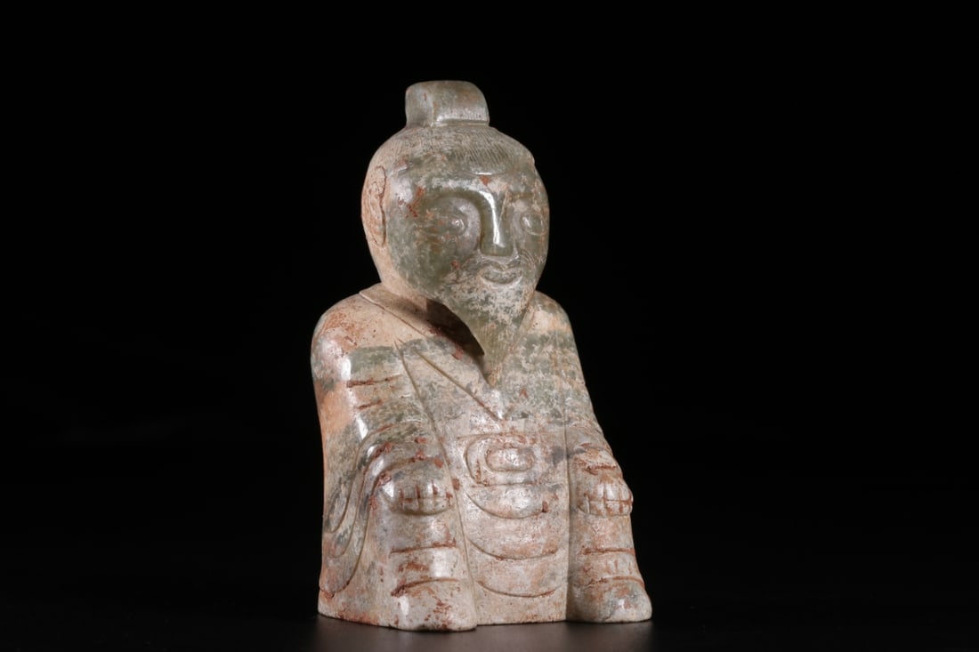 An Archaic Jade Human Figurine Ornament: An Archaic Jade Human Figurine Ornament. Height: 3.35in; Length: 1.69in; Width: 1.77in; Weight: 0.53lbs.