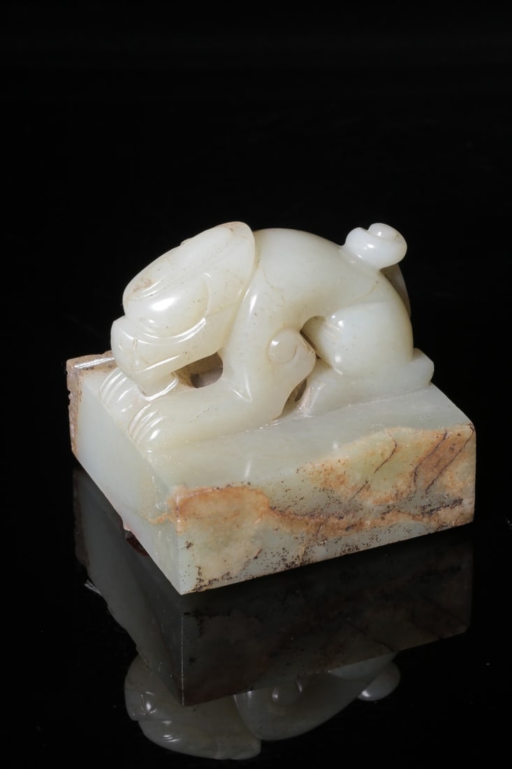 A Hetian Jade Seal: A Hetian Jade Seal. Height: 2.68in; Length: 2.56in; Width: 2.44in; Weight: 0.82lbs.