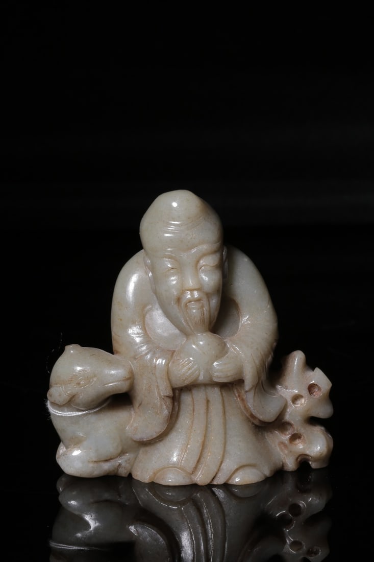 A Hetian Jade Shouxing and Deer Ornament: A Hetian Jade Shouxing and Deer Ornament. Height: 3.35in; Width: 3.15in; Thickness: 1.18in; Weight: 0.46lbs.