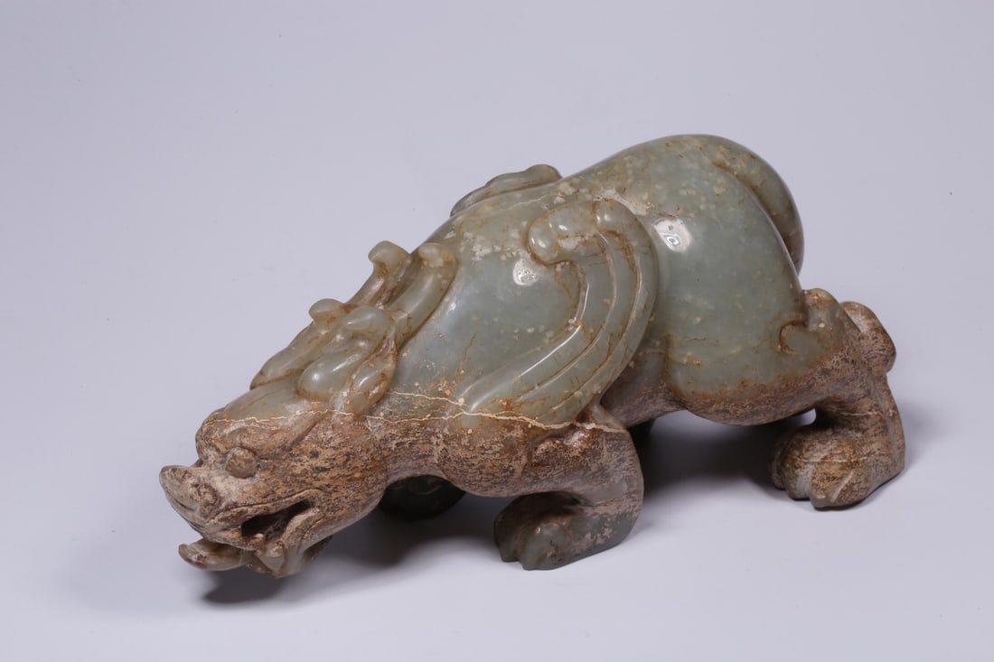 An Archaic Jade Tianlu Ornament: An Archaic Jade Tianlu Ornament. Height: 3.54in; Length: 7.48in; Width: 2.76in; Weight: 2.66lbs.