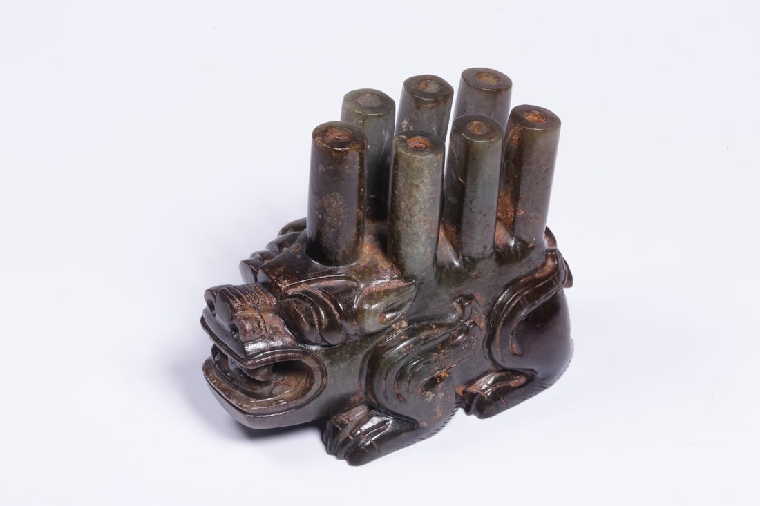 An Archaic Jade Mythical Beast Ornament: An Archaic Jade Mythical Beast Ornament. Height: 2.56in; Length: 3.23in; Width: 1.77in; Weight: 0.62lbs.