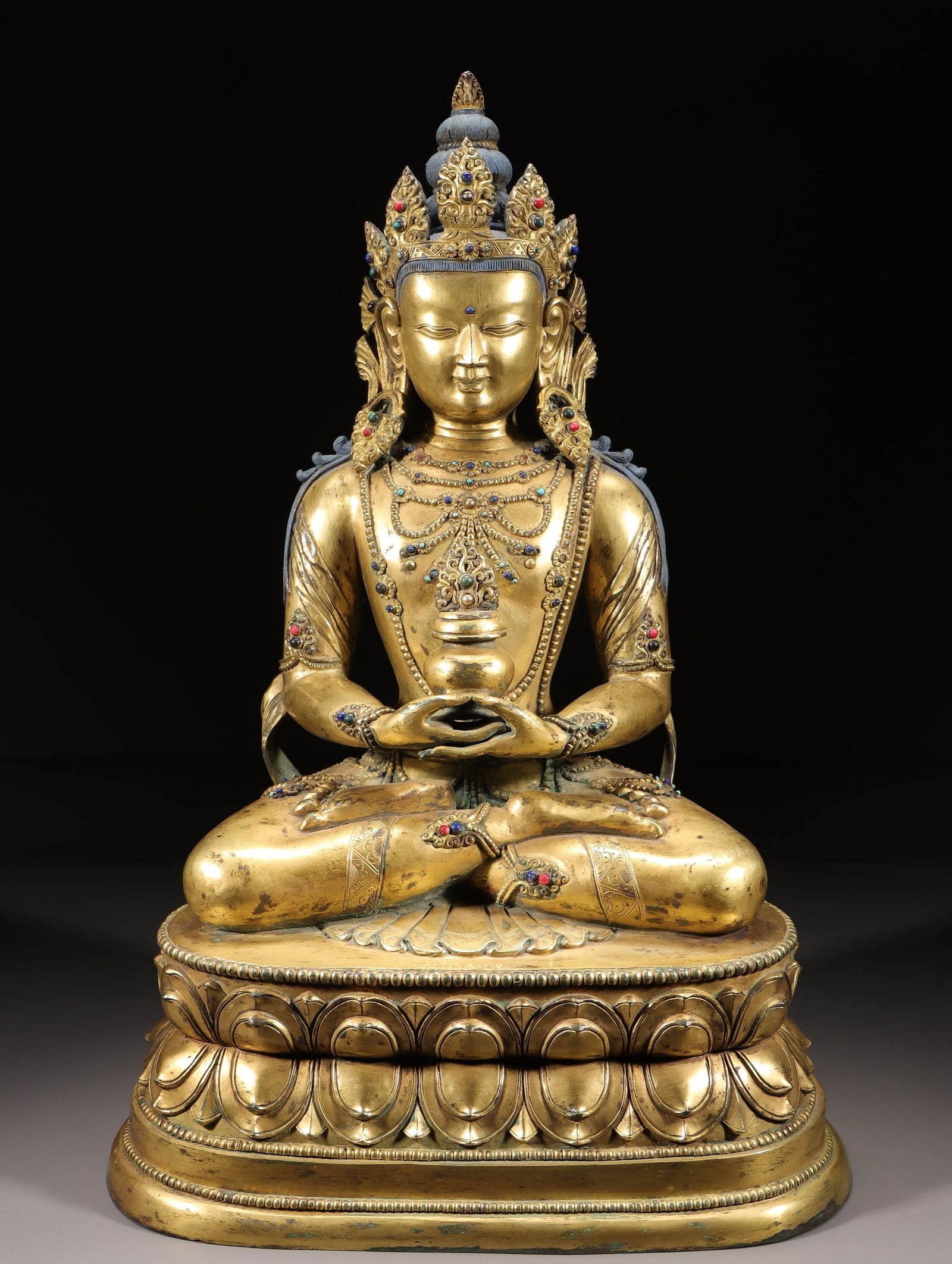 A Gilt Bronze Amitayus Buddha Statue With Inlaid Ornaments: A Gilt Bronze Amitayus Buddha Statue With Inlaid Ornaments. Dimensions: 20.47 × 12.99 × 8.27 in; Weight: 44.092 lb.