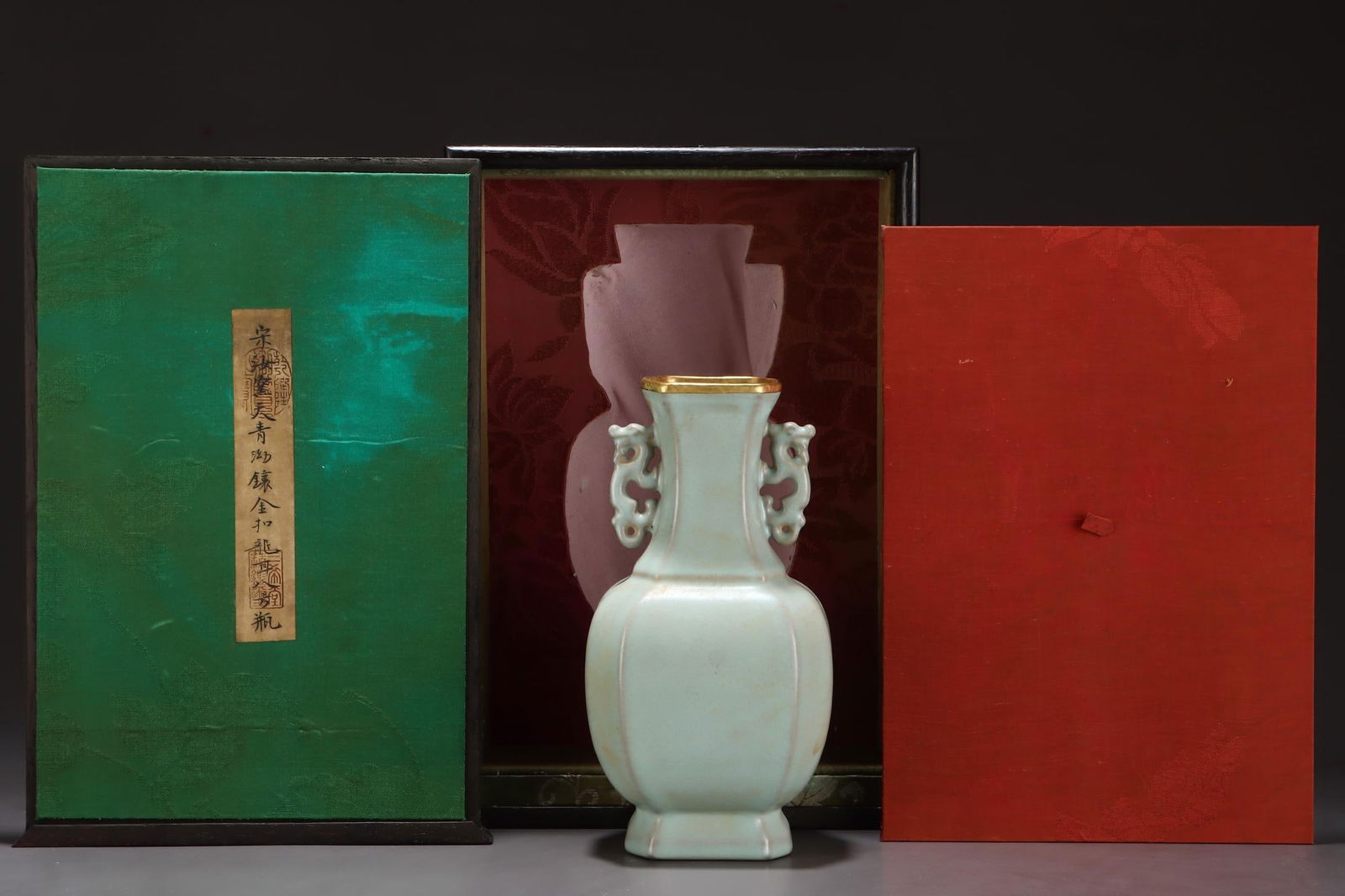 A Ru Ware Celadon Glazed Octagonal Double-Dragon Vase With Gilt Rim: A Ru Ware Celadon Glazed Octagonal Double-Dragon Vase With Gilt Rim. Height: 9.25in Width: 4.72in.