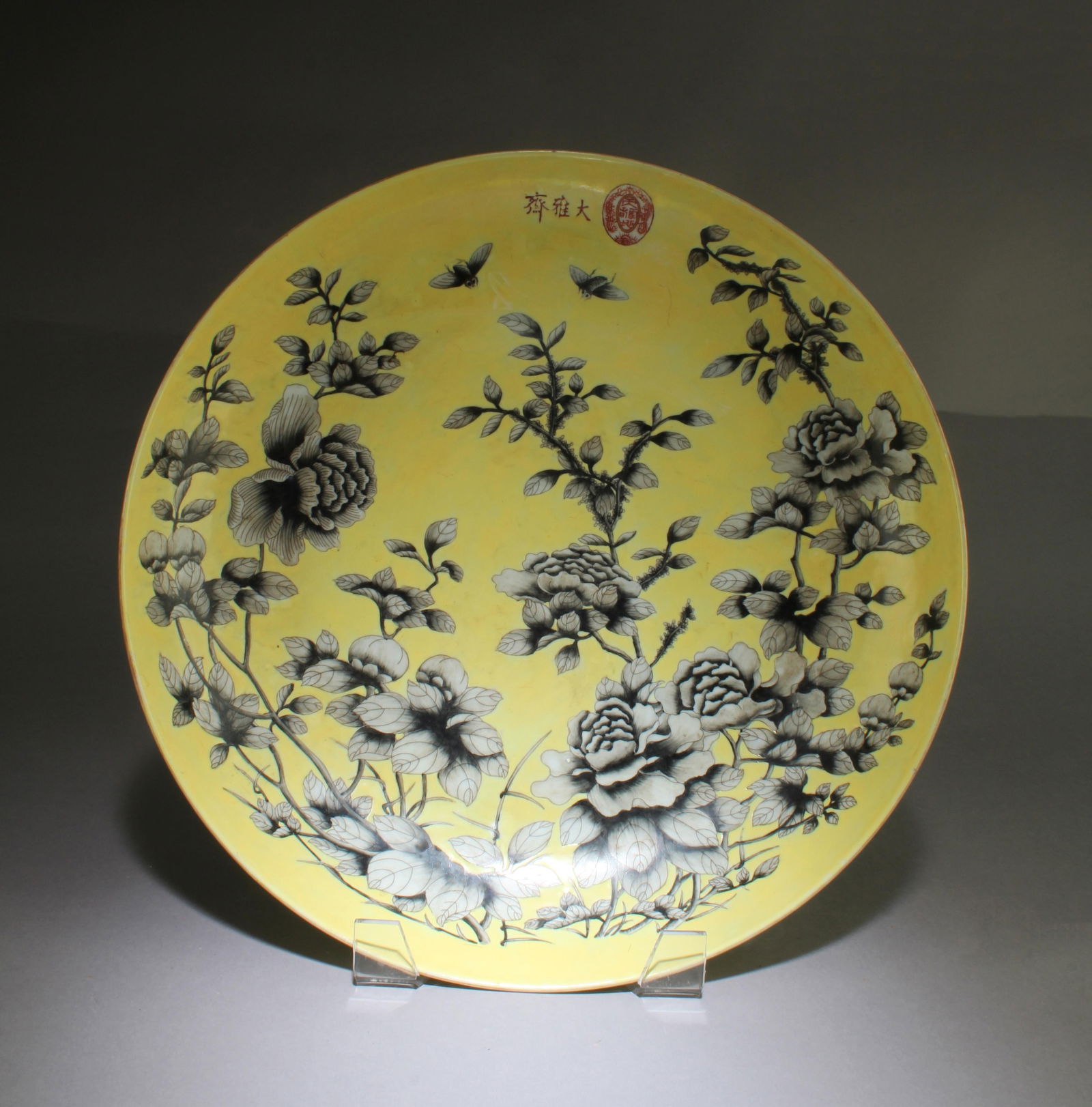A Porcelain Charger: A Porcelain Charger. Four characters mark at base. Diameter: 14"