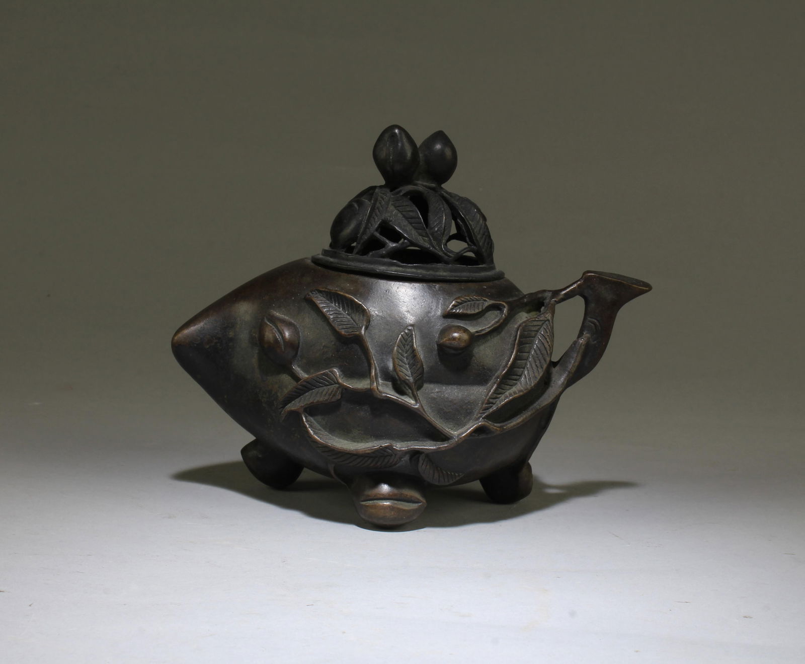 A Bronze Censer: A Bronze Censer with lid. Four character mark at base. Height: 5.75" Length: 7.25"