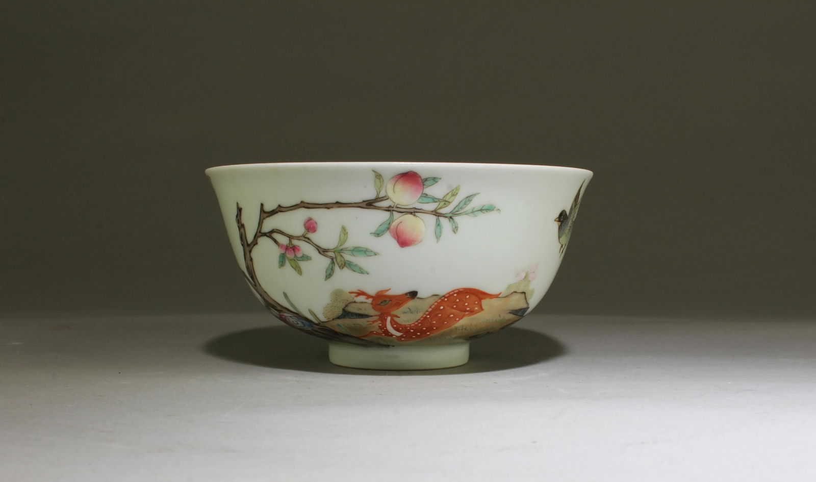 A Porcelain Cup: A Porcelain Cup. 'QianLong' mark. Height: 2.5" Diameter: 5.25"