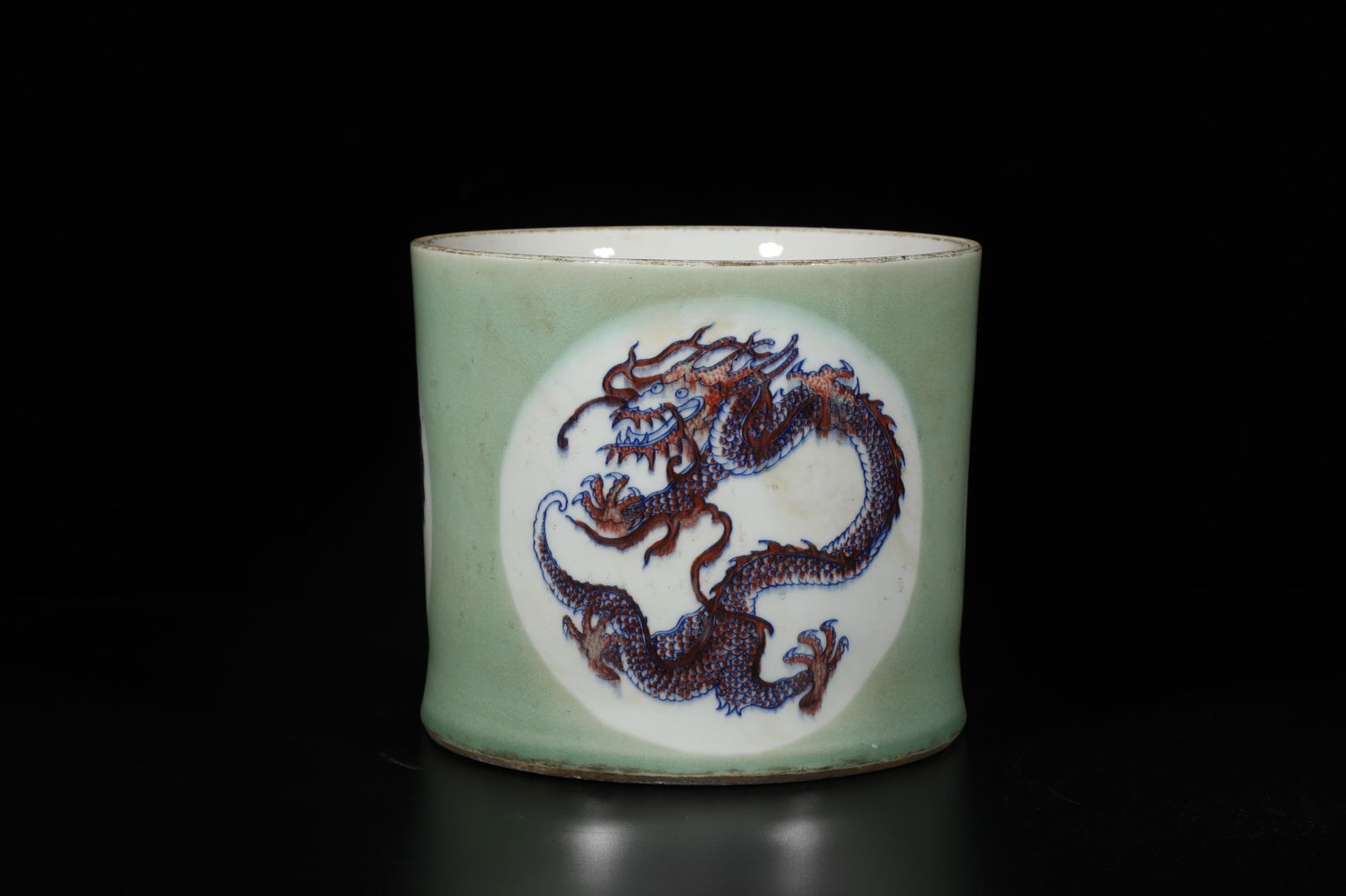 A Porcelain Brushpot: A Porcelain Brushpot. 'KangXi' mark at base. Diameter: 7.5" Height: 6.5"