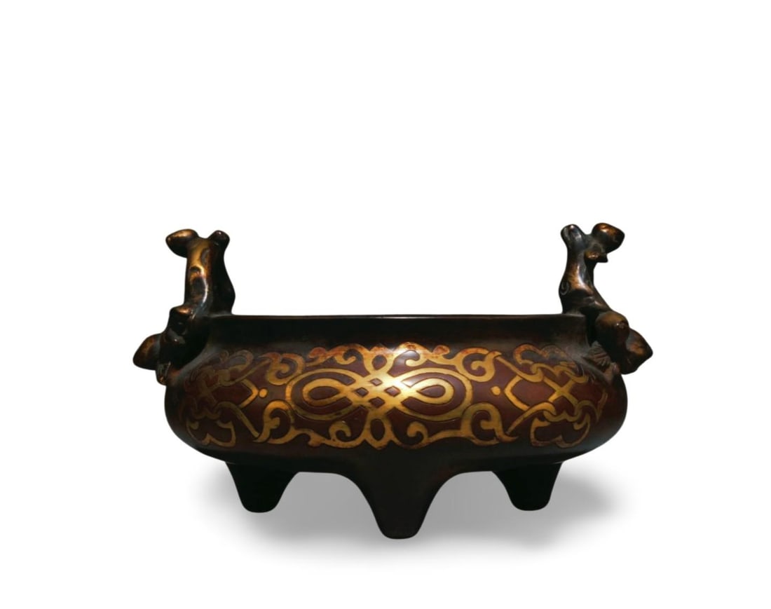 A Bronze Tripod Incense Burner: A Bronze Tripod Incense Burner. Dimensions: 4" x 7".