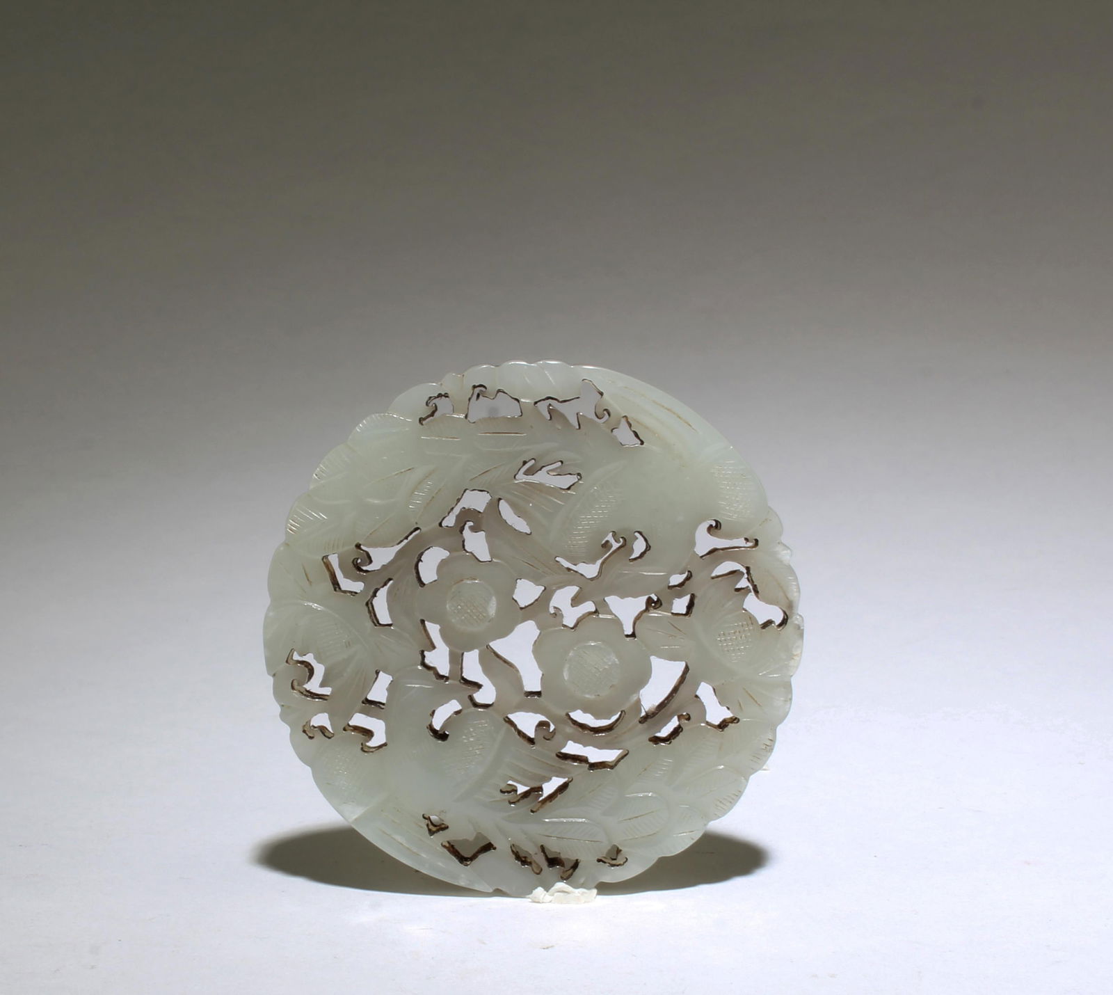 A Round Carved Jade Ornament (1 of 3)