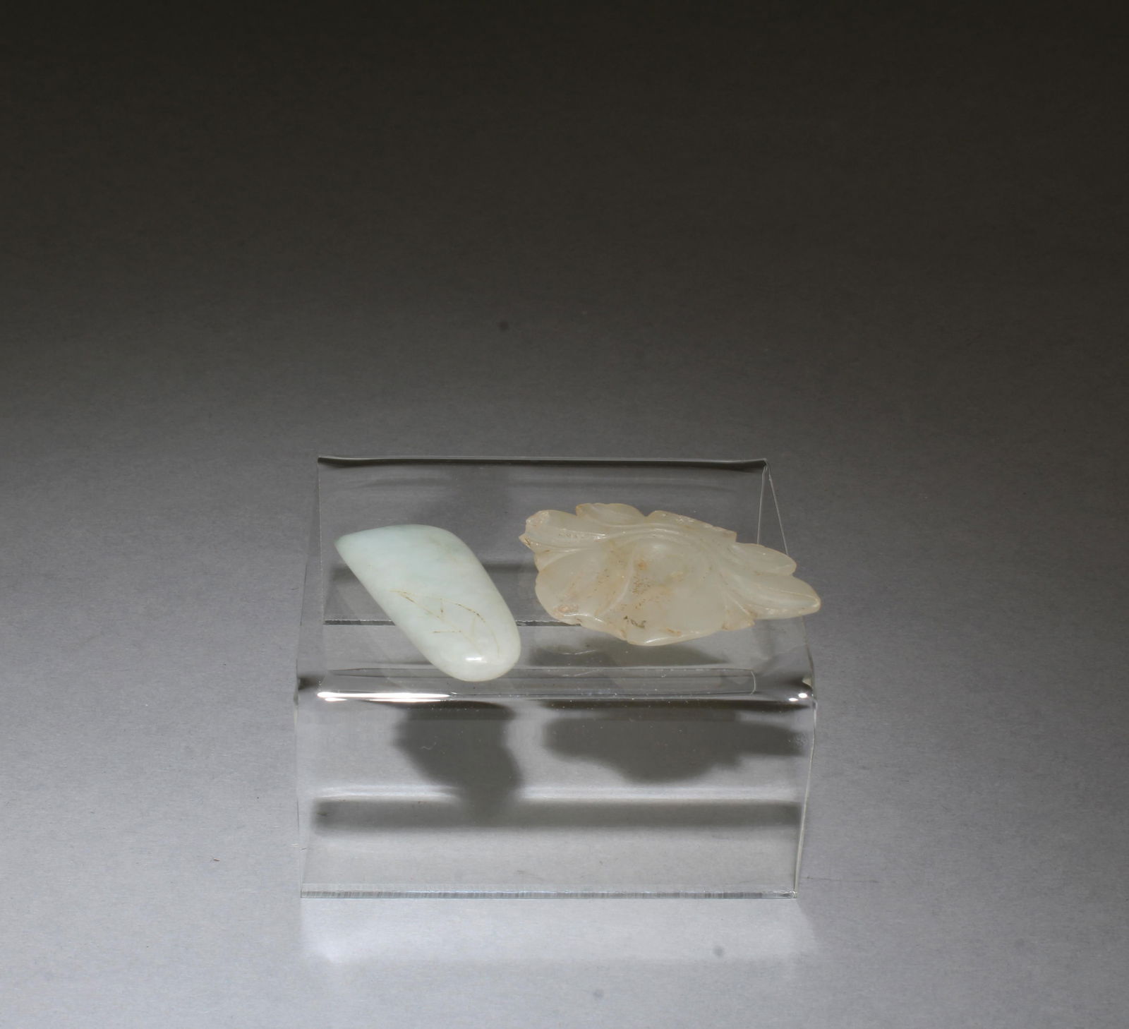 A Group of Two Jade Ornaments: A Group of Two Jade Ornaments. Length: 1.9" (longer)