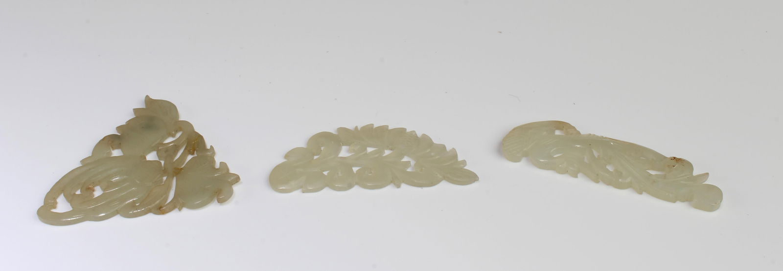 A Group of Three Jade Pendants: A Group of Three Jade Pendants. Length: 2" (Longest)