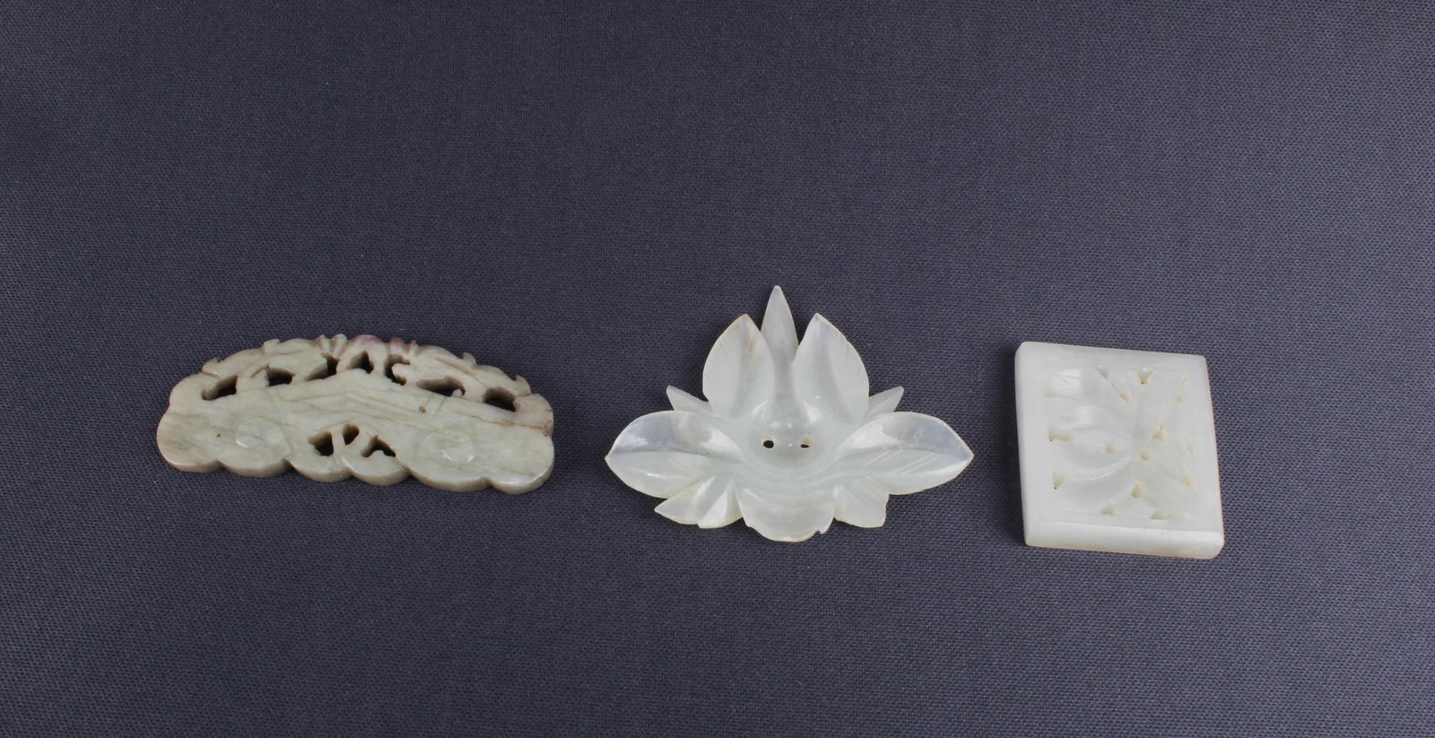 A Group of Three Jade Pendants: A Group of Three Jade Pendants. Length: 2" (Longest)