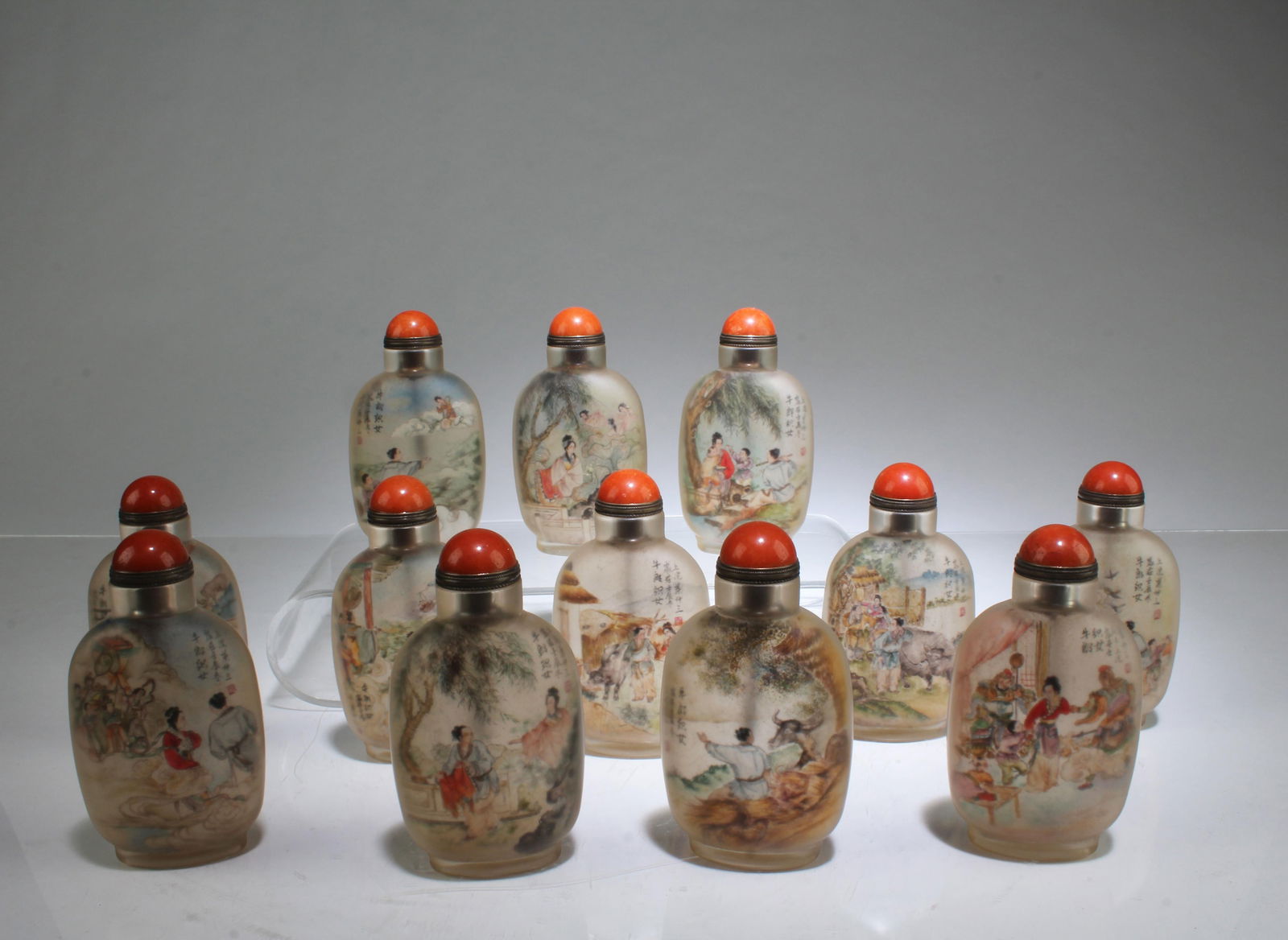 A Dozen of Peking Glass Snuff Bottles: A Dozen of Peking Glass Snuff Bottles, comes with a box. Height: 3.25"