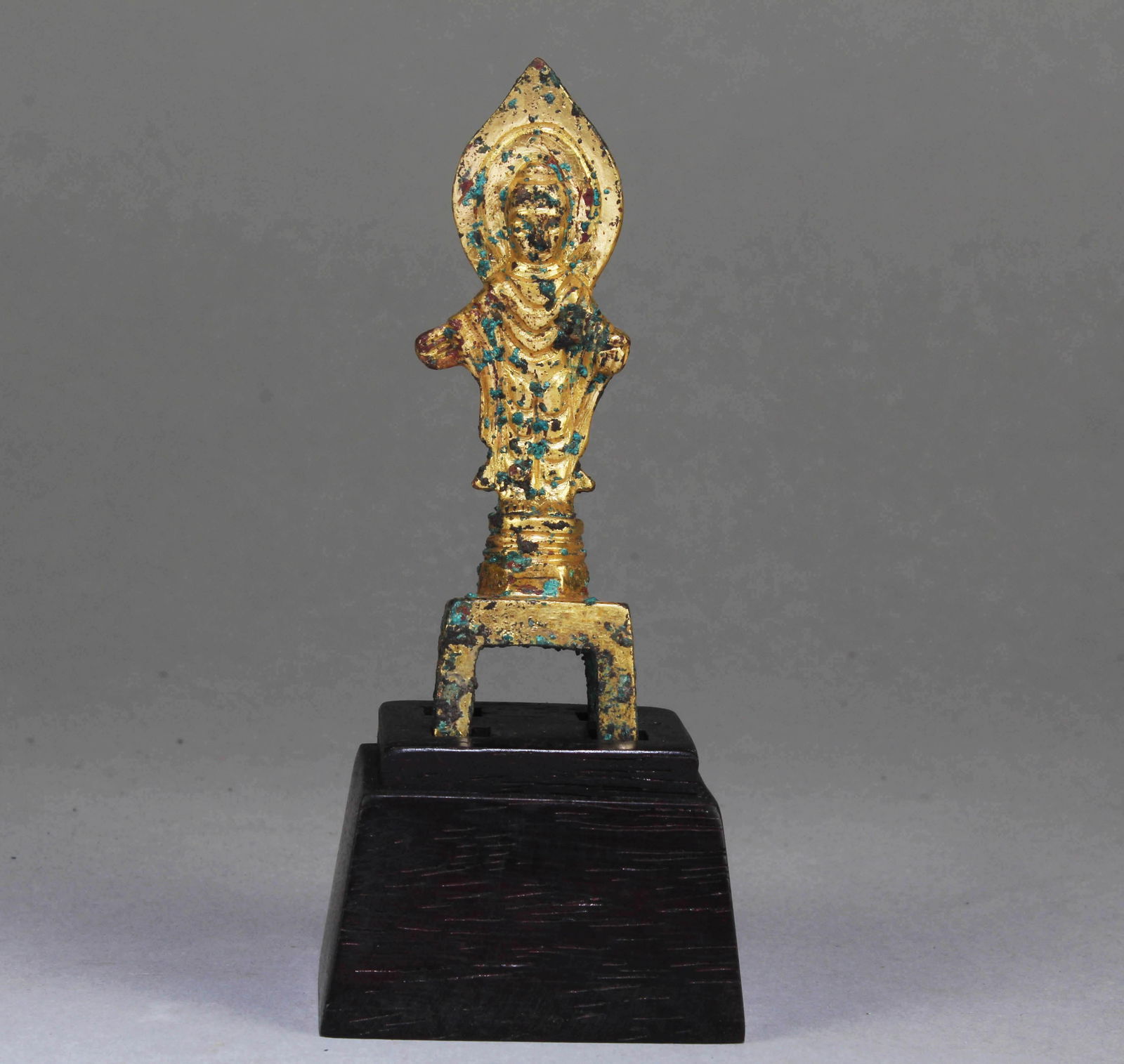 A Chinese Gilt Bronze Buddha: A Chinese Gilt Bronze Buddha. Dimension: 3.1" x 1" x 0.75". Dimension with Stand: 4.25" x 1.75" x 1.5".