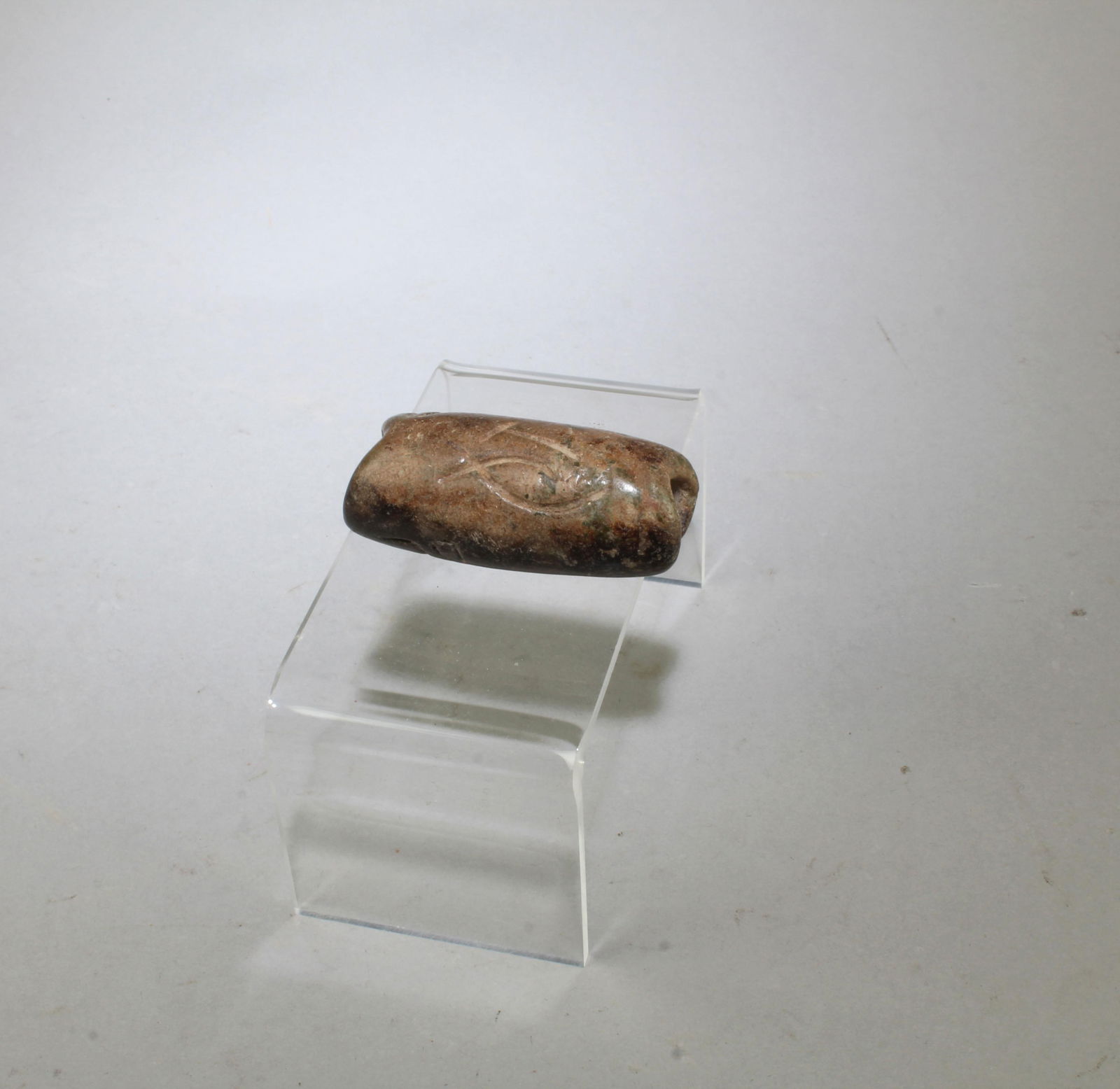 A Carved Jadestone Ornament: A Carved Jadestone Ornament. Length: 2.2"