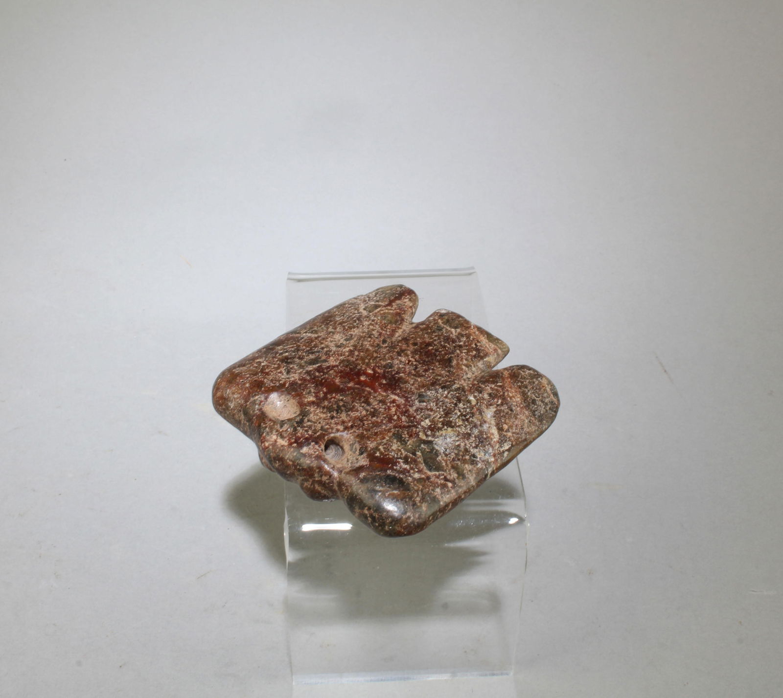 A Carved Jadestone Ornament: A Carved Jadestone Ornament. Length: 2.5"