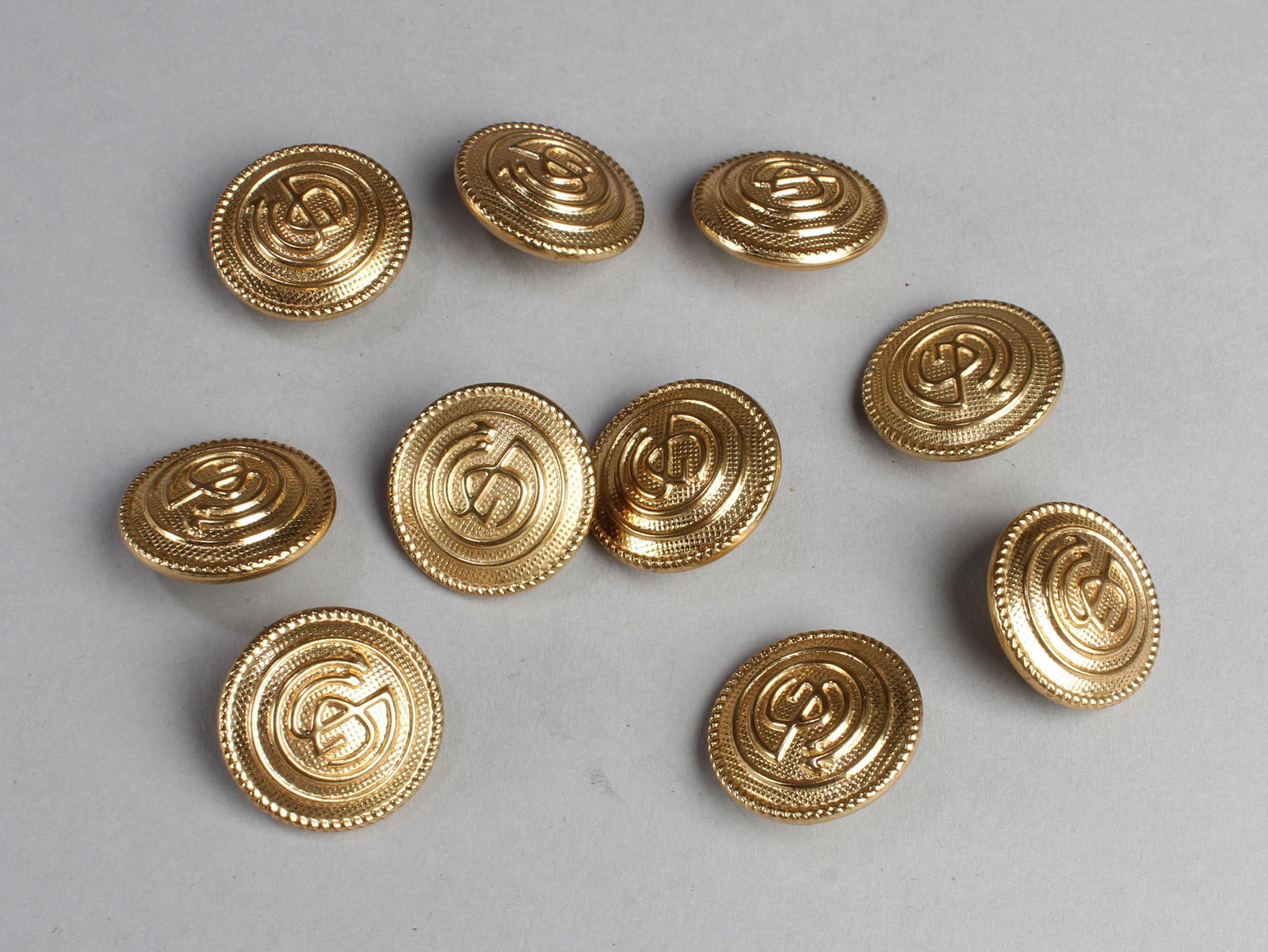 A Group of Ten Buttons: A Group of Ten Buttons. Diameter: 0.75"