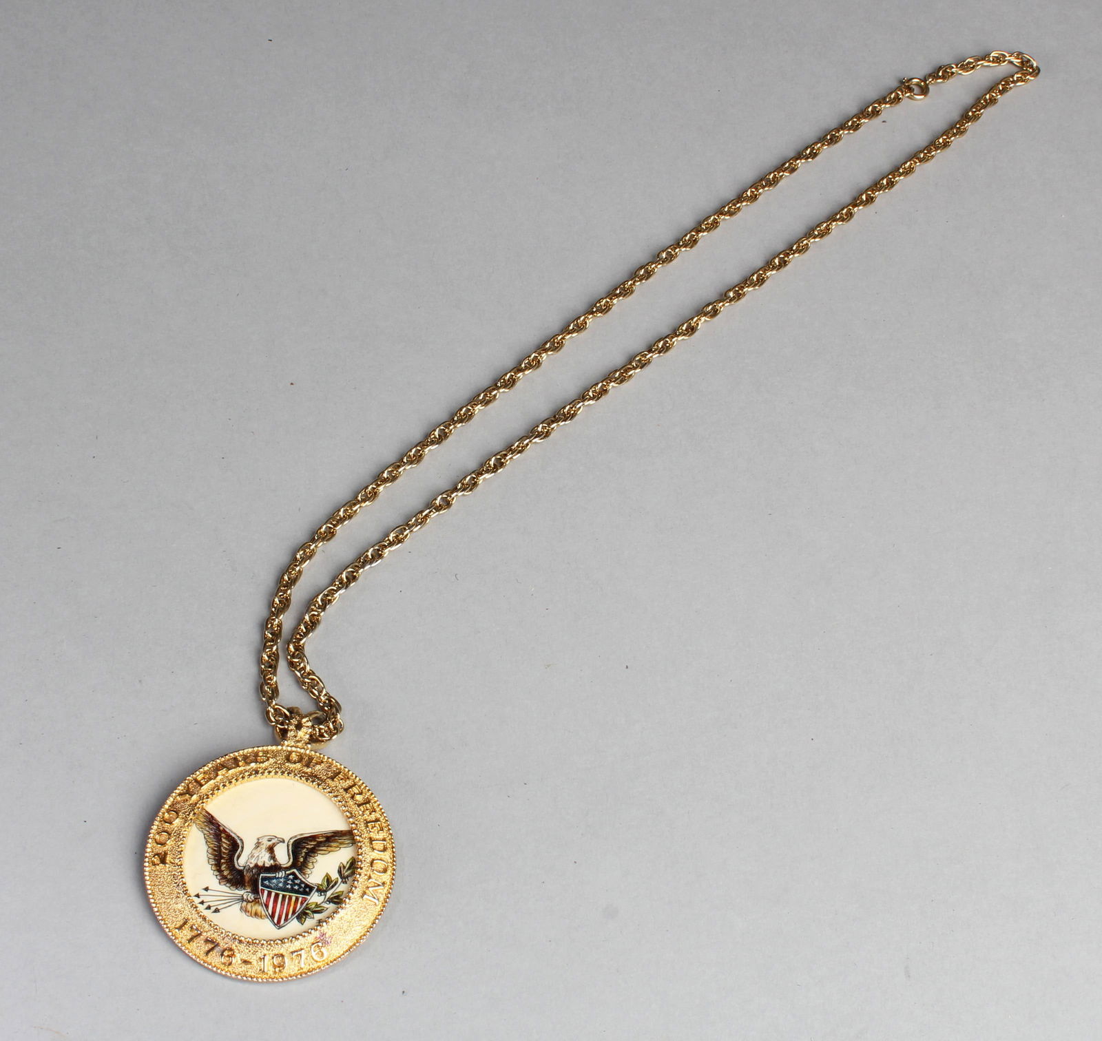 A Medal with Necklace: A Medal (200 Years of Freedom 1776 - 1976) with Necklace. Diameter: 2"