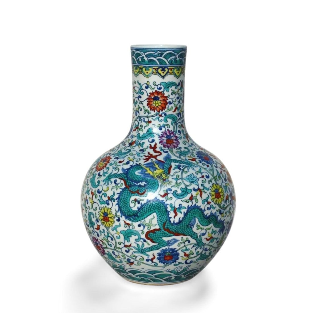 A Doucai Celestial Sphere Vase: A Doucai Celestial Sphere Vase. Dimension: 10.5" x 16".