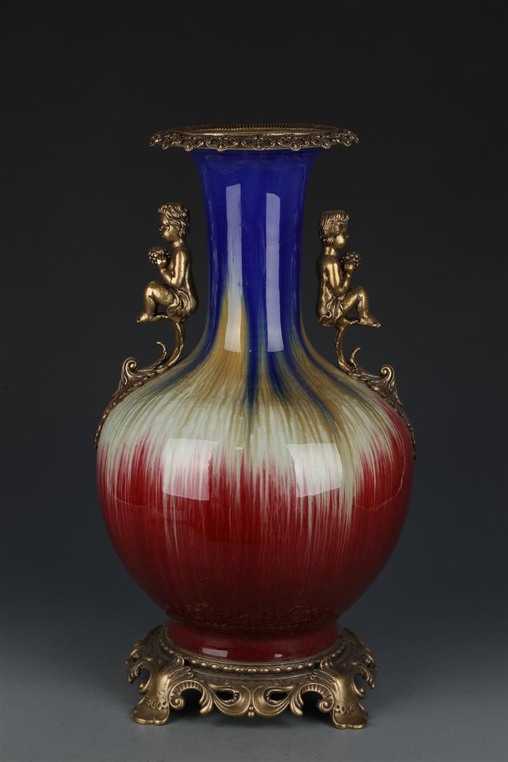 Chinese Porcelain Vase: Chinese Porcelain Vase, the base and rim encased with bronze. 'QianLong' mark. Height: 17.1" Diameter: 11 "