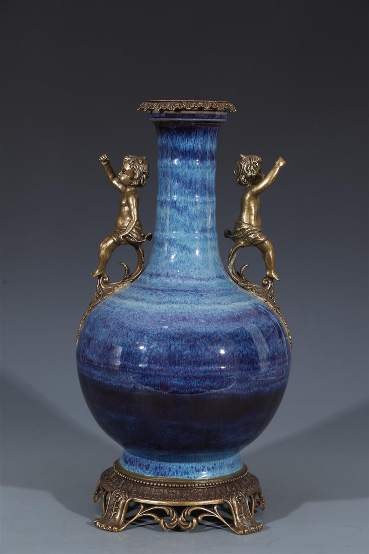 Chinese Porcelain Vase: Chinese Porcelain Vase, the base and rim encased with bronze. 'QianLong' mark. Height: 16.5" Diameter: 9.5"