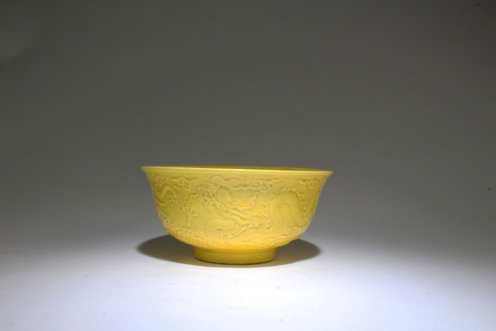 A Famille Jaune Porcelain Bowl: A Famille Jaune Porcelain Bowl. 'TongZhi' mark. Height: 3" Diameter: 6.25"