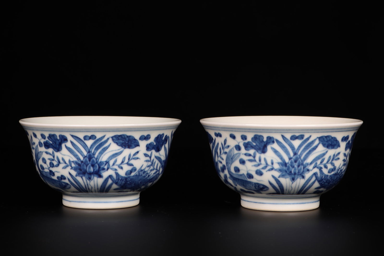 A Pair of Blue and White Cups: A Pair of Blue and White Cups. Dimensions: 3.3" x 1.8".