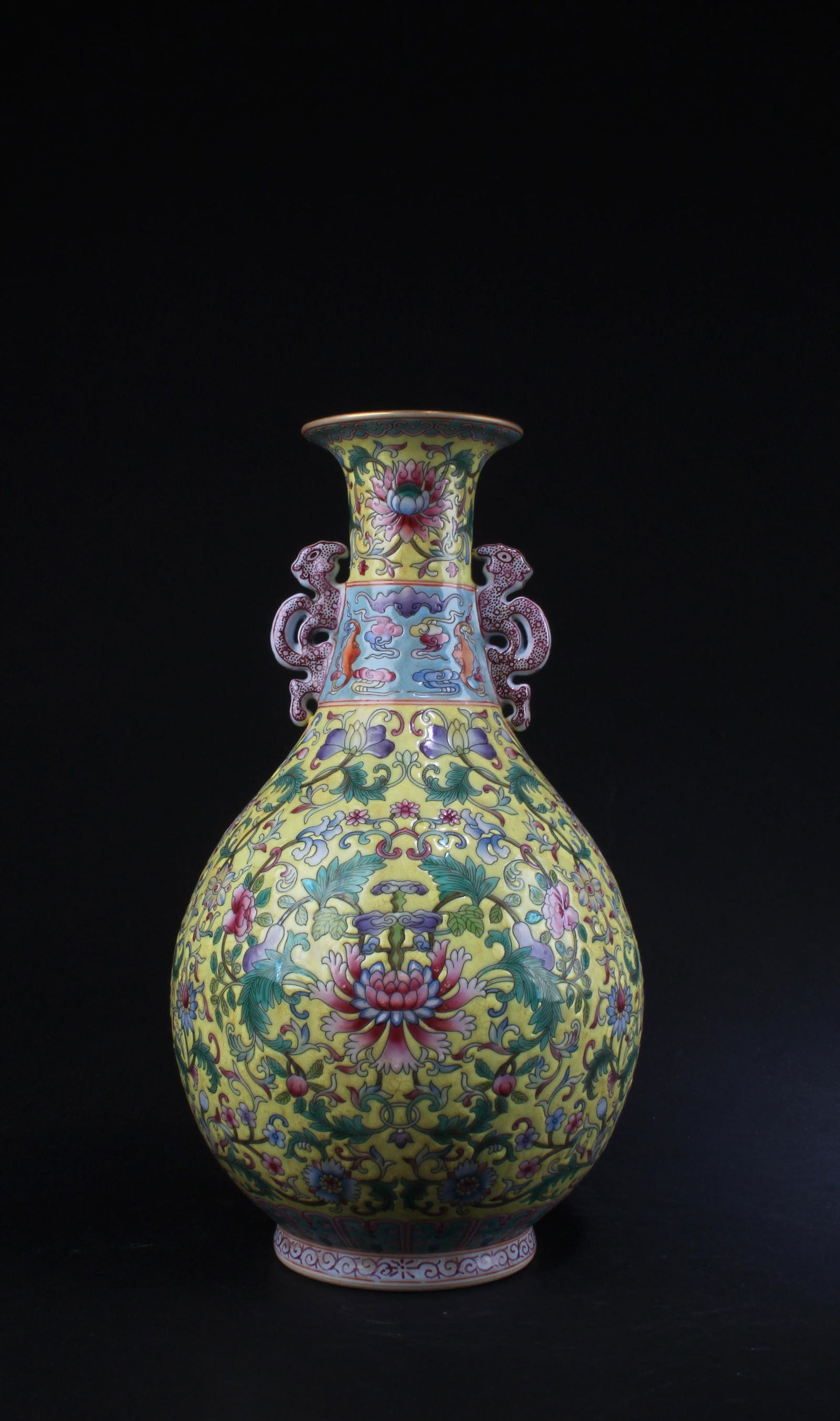 Chinese Porcelain Vase: Chinese Porcelain Vase, flanked by twin handles. 'QianLong' mark. Height: 12.25"