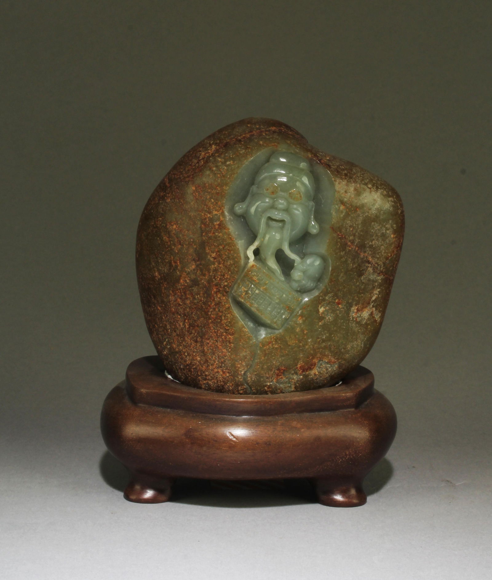 Chinese RiverJade Carved Ornament: Chinese RiverJade Carved Ornament. Comes fitted with a wood stand. Height: 4.25"